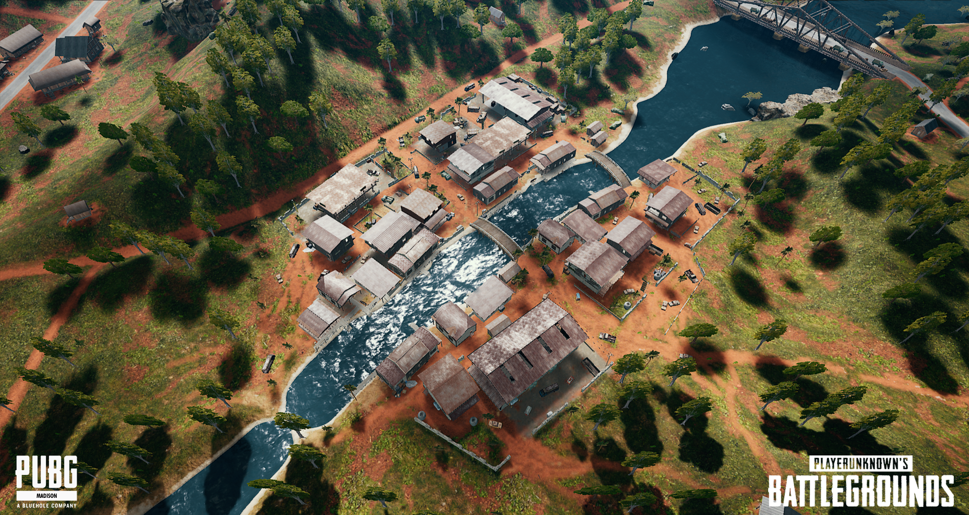 Aerial view of a small town with a river running through it, surrounded by trees and dirt roads, from the game PUBG Battlegrounds.