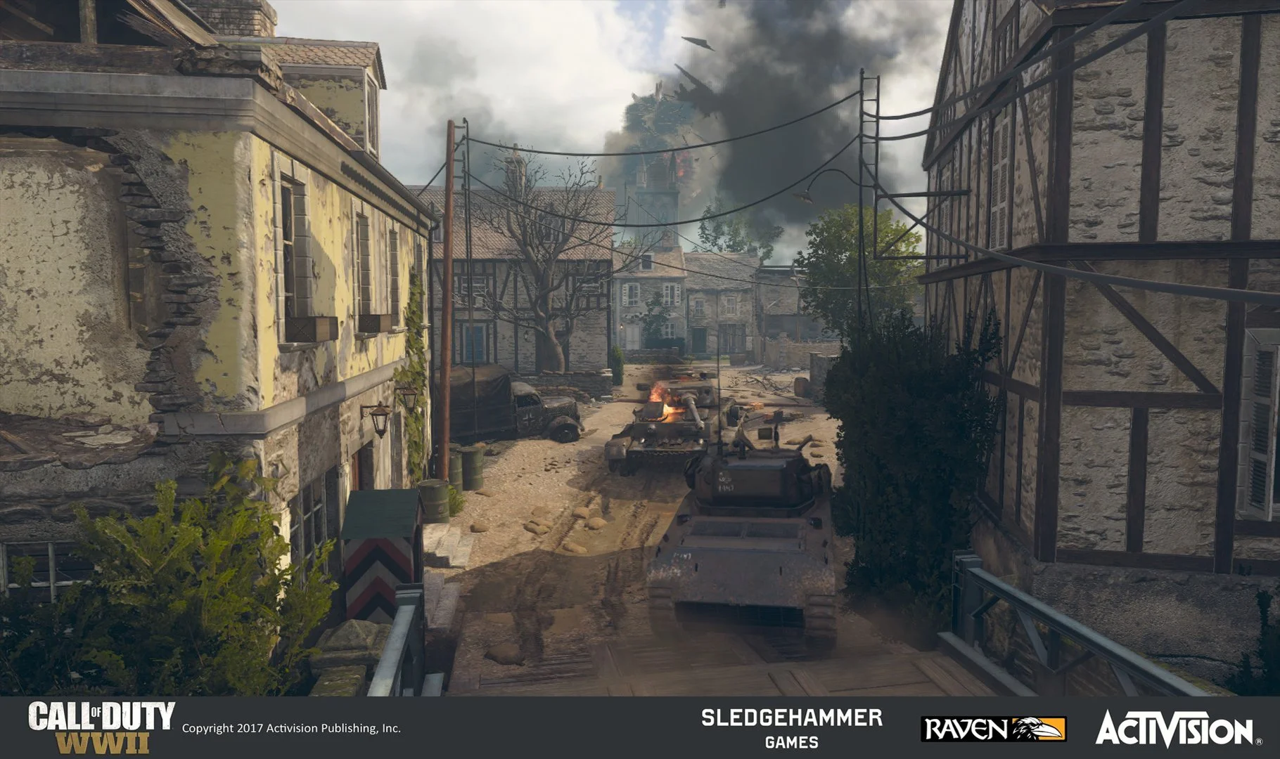 A war scene from Call of Duty WWII, showing a tank driving down a damaged street lined with damaged buildings, with smoke rising in the background and military aircraft flying overhead.