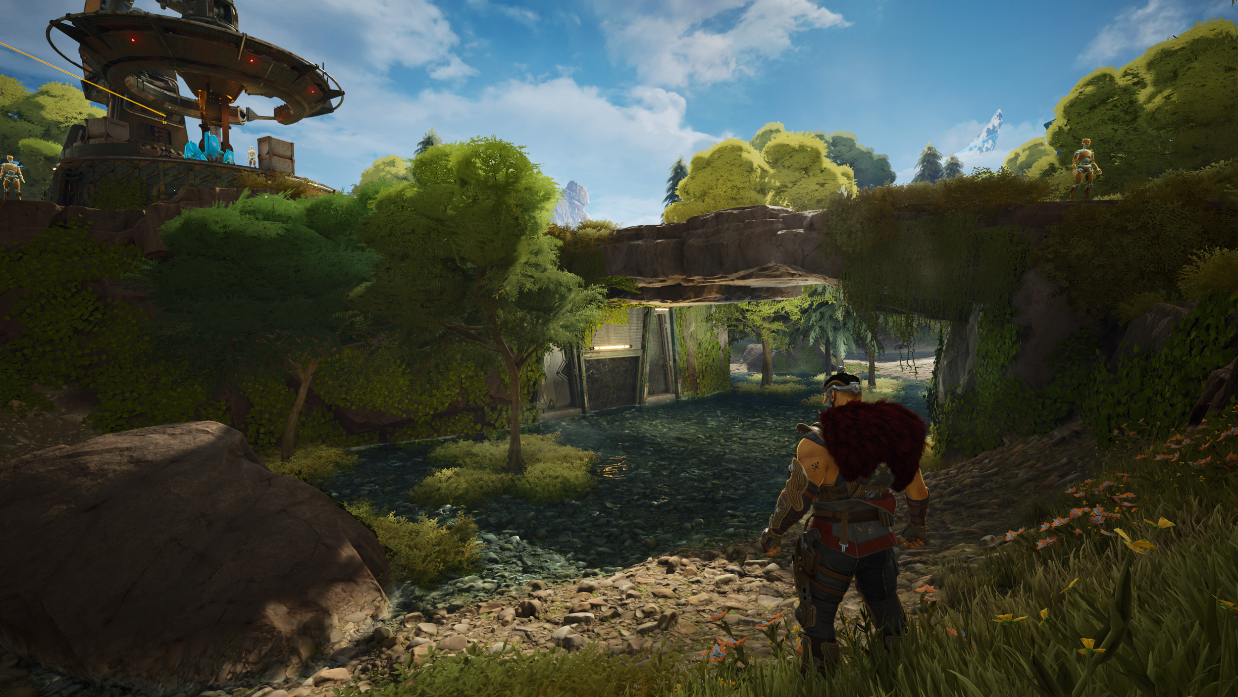 A lush greenery landscape with a small river flowing through, surrounded by trees, rocks, and foliage. There are a few characters in armor standing on the upper and lower levels of the scene, with a futuristic structure in the background, under a blu