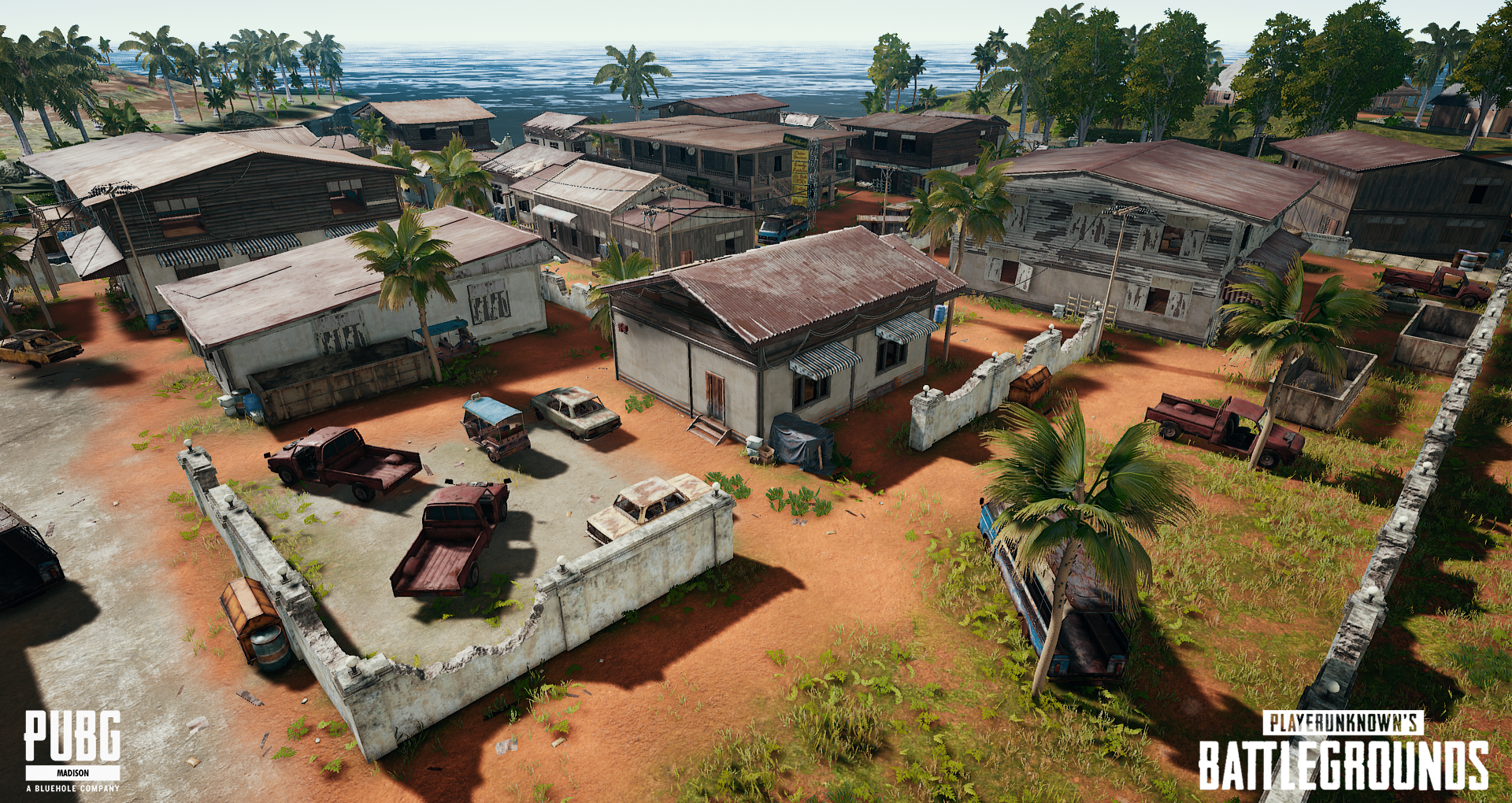 Aerial view of a small coastal town with palm trees, some buildings with rusted roofs, abandoned vehicles, and a distant body of water. Logo texts of PUBG and PLAYERUNKNOWN'S BATTLEGROUNDS are at the bottom corners.