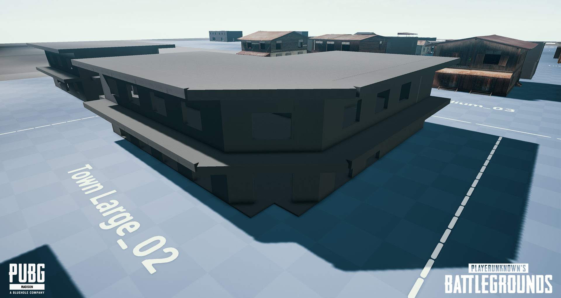 A 3D model of a building from the game PUBG, located in the Town Large - 02 area, with multiple surrounding structures, on a map labeled 'Town Large - 02' in a virtual environment.
