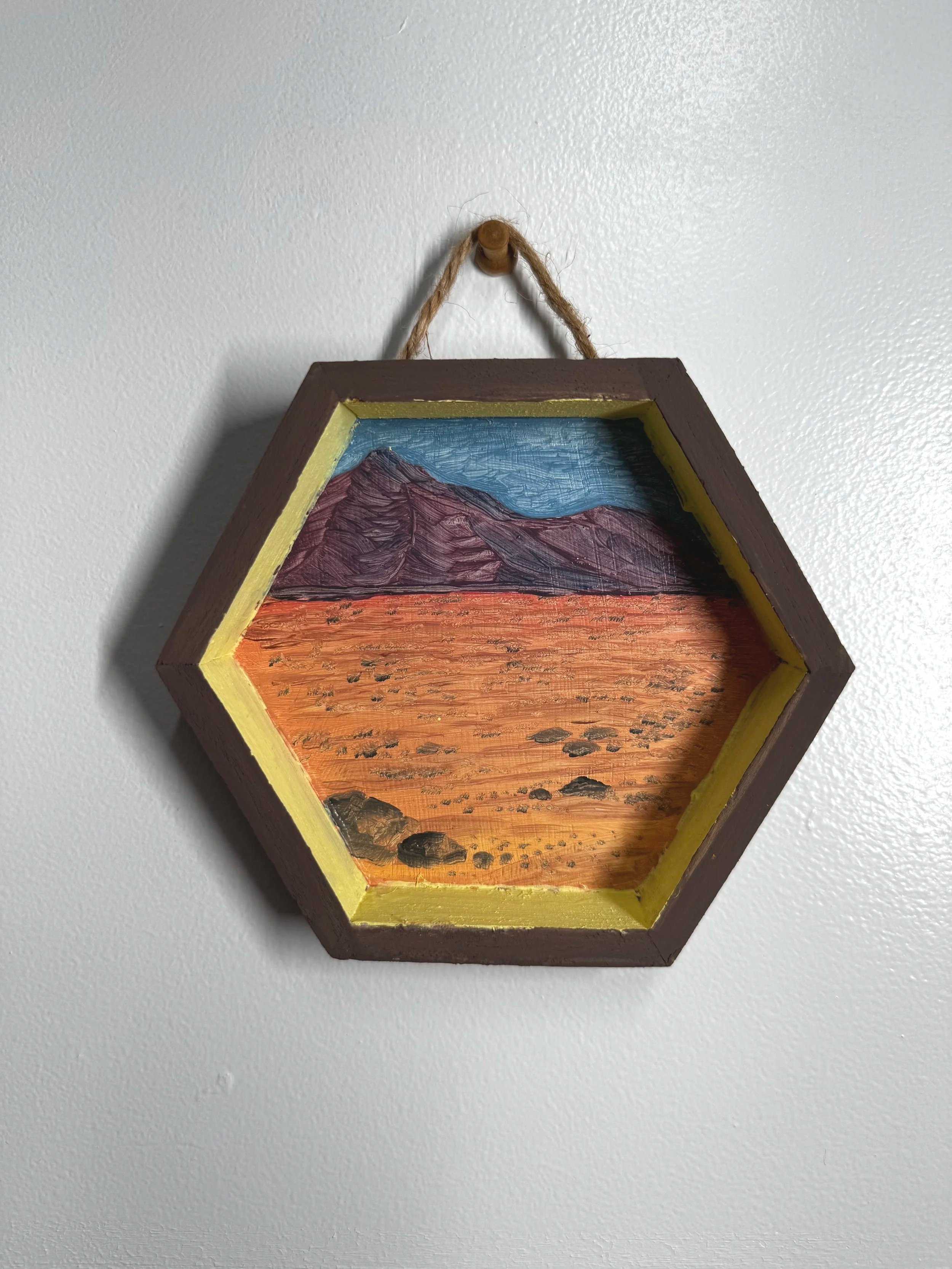 "Mars Surveyor" 5 inches x 5 inches, Oil on wood, 2025 A terrain mapped for mining — or a landscape already decoded? The colors vibrate with otherworldly intensity, like a satellite imagining earth. This is both wilderness and simulation, evoking a f