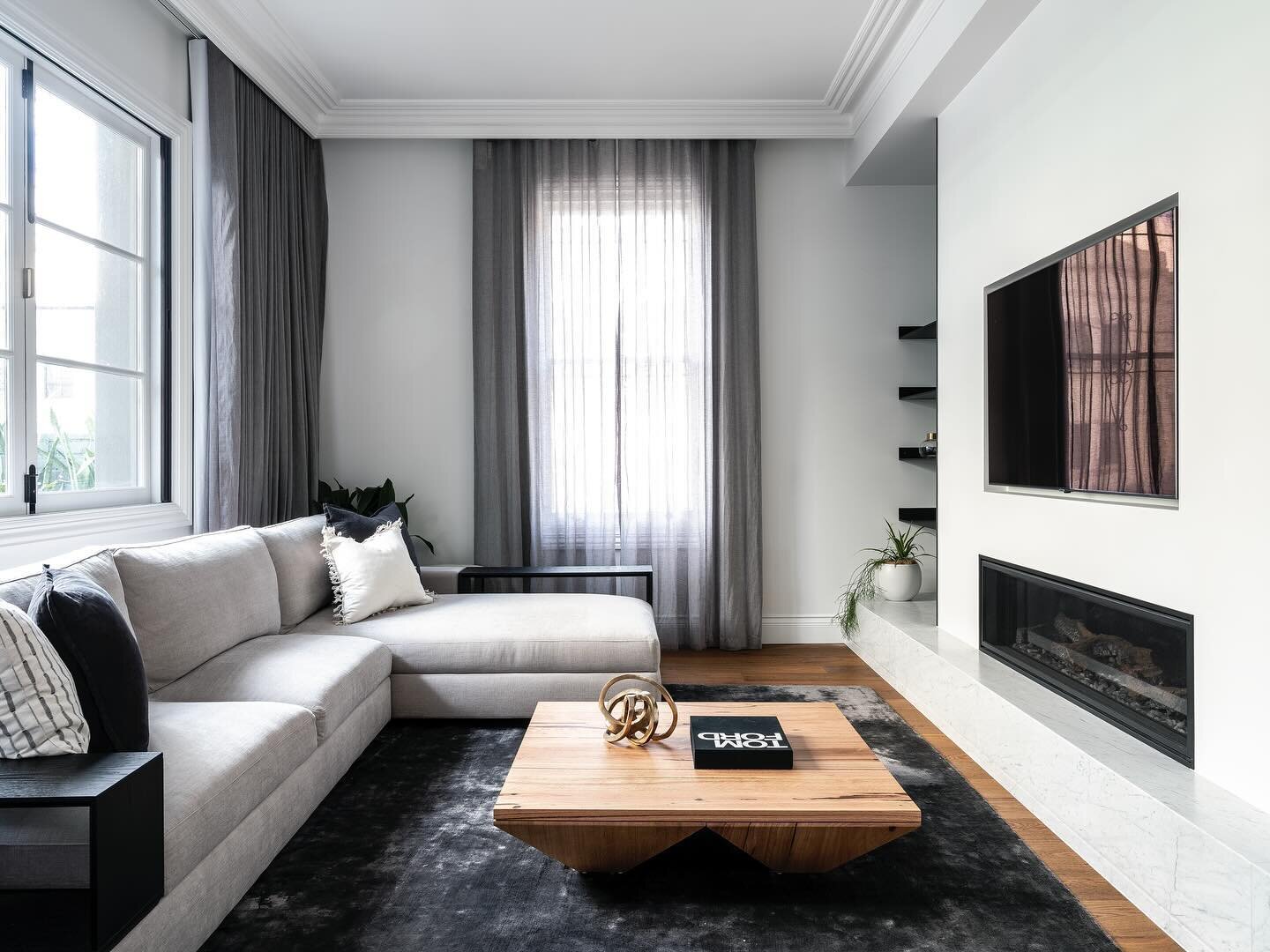 RILEY &bull; This modern living space pays homage to the properties heritage through the use of traditional cornices and soft grey window furnishings #InnovateInteriors