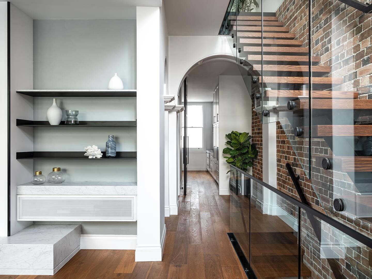 RILEY &bull; Floating shelves and floating stairs help this inner-city home feel open and spacious #InnovateInteriors