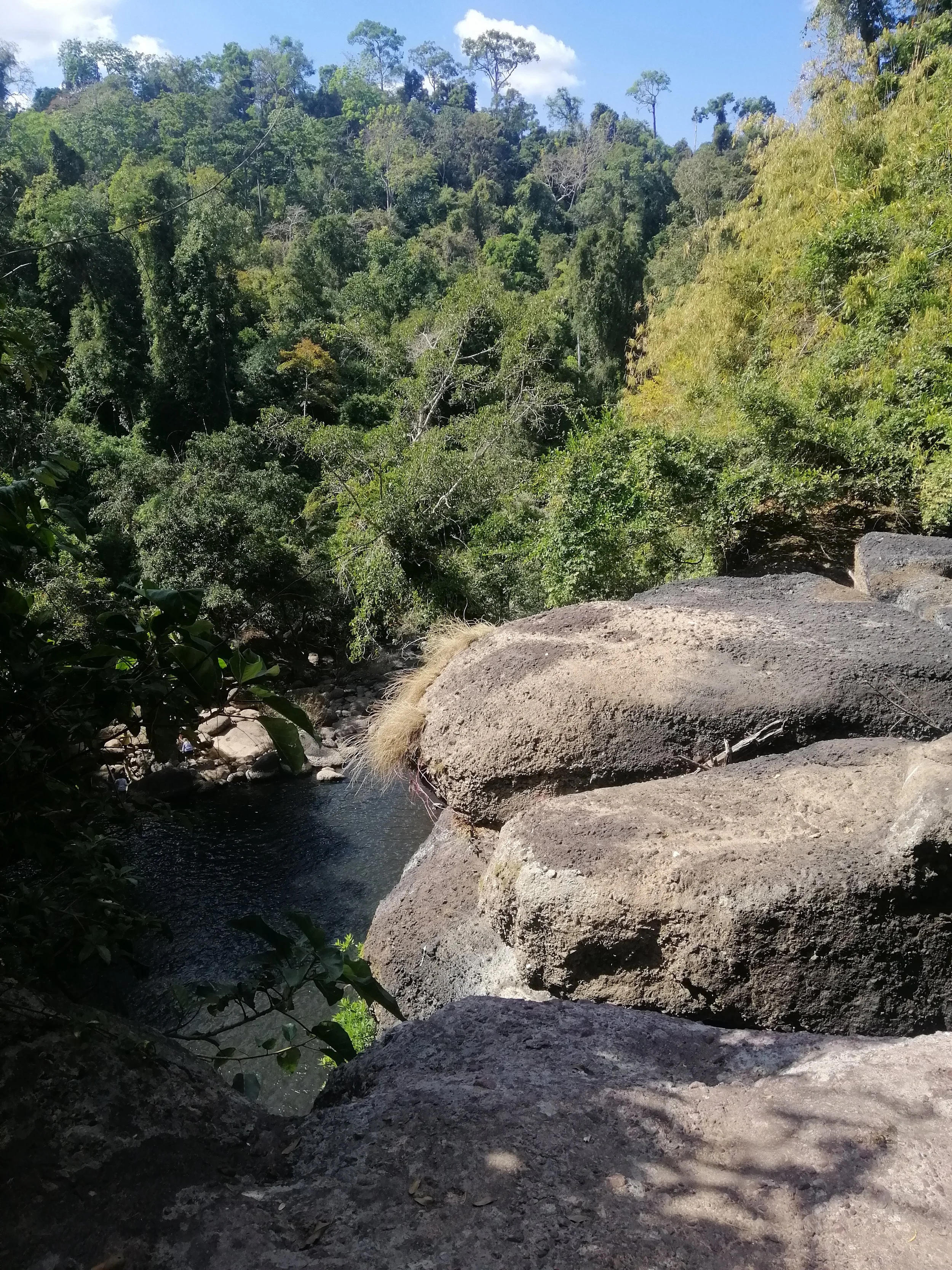 The massive rocks at Haew Suwat Waterfall are  rhyolite. 