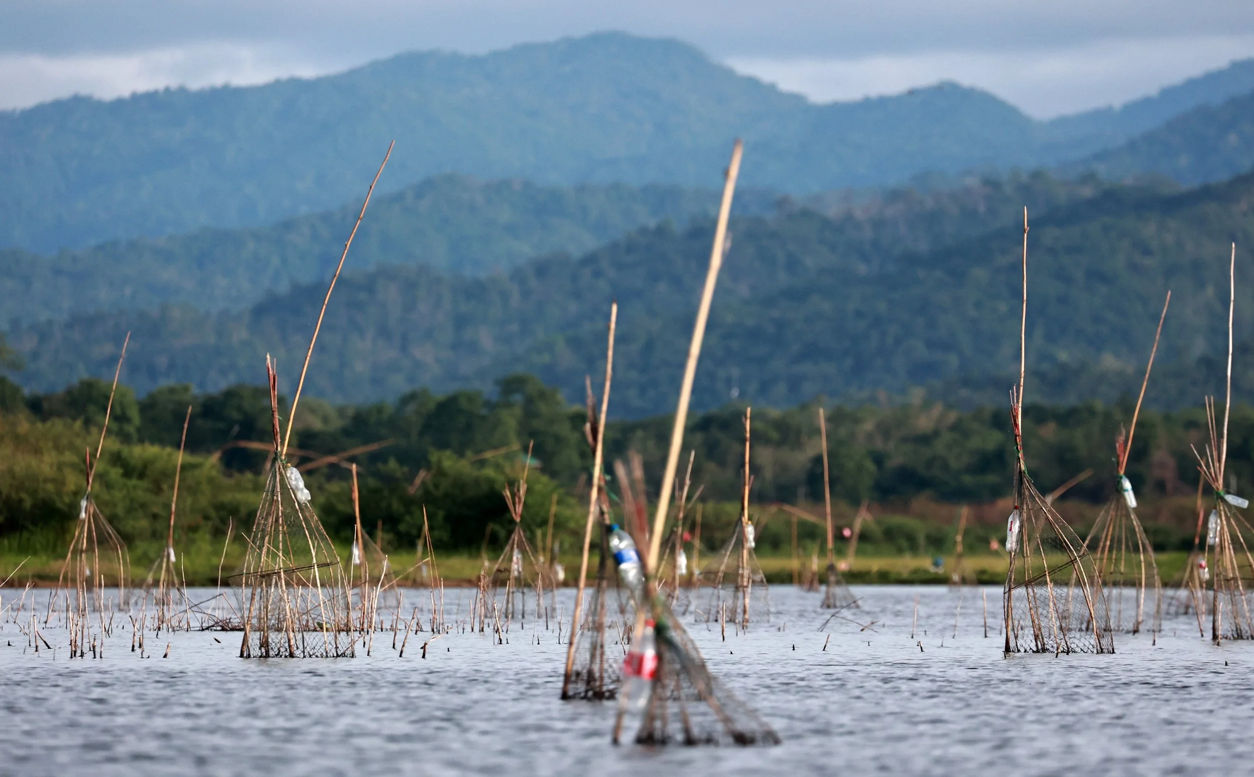 Thai style Intha fishing.  Very similar to the Intha fishermen in Burma.  Interesting to know the connection.