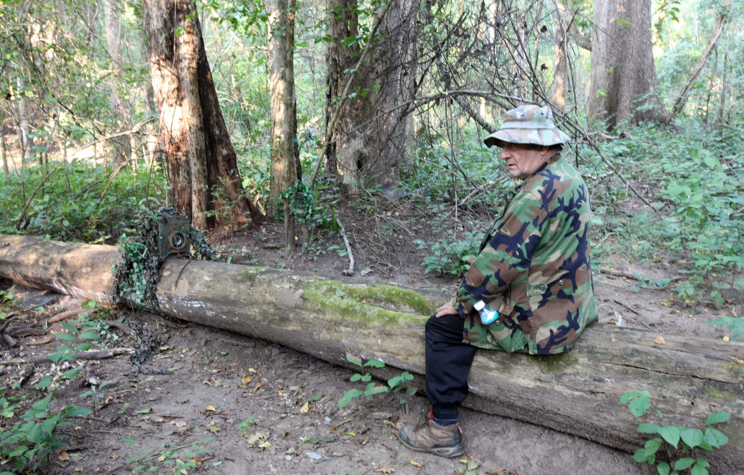 Bruce analysing the best way to orient a camera trap along perhaps the most famous log in Huai Kha Khaeng.  