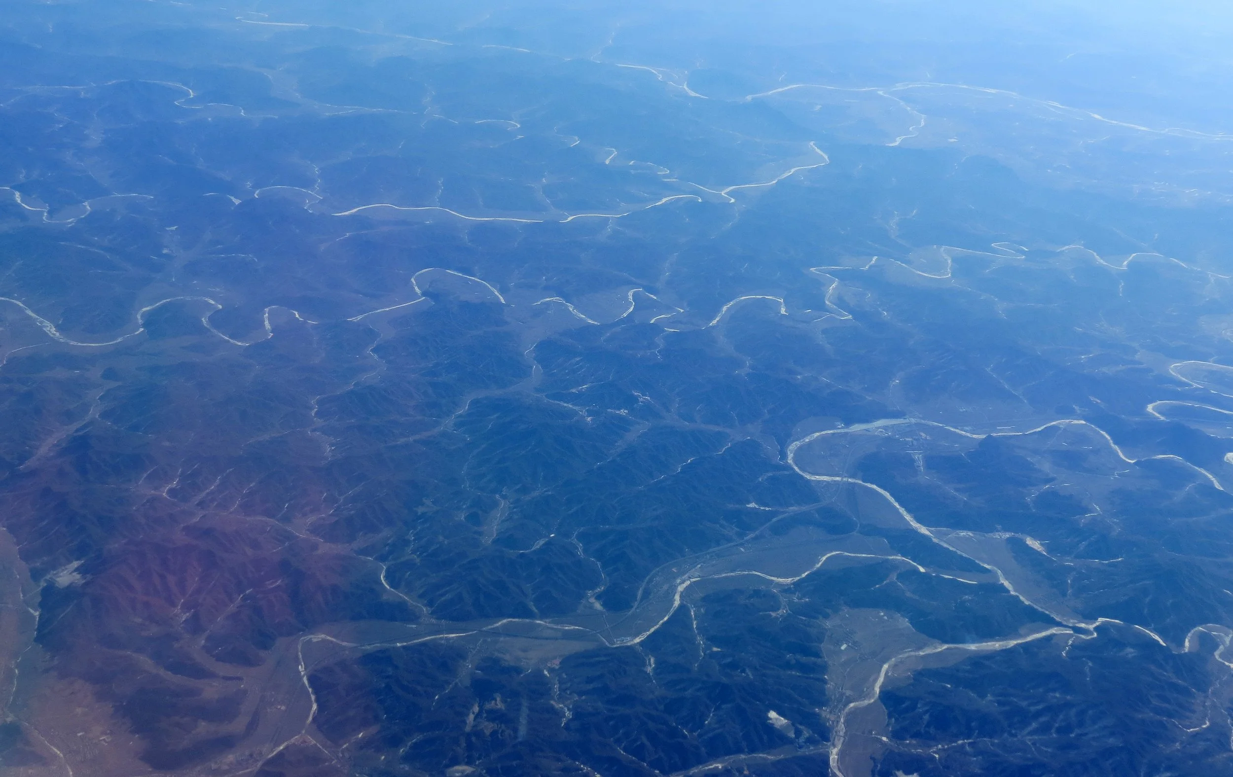 North Korea!  Seen at low altitudes from Chinese airline