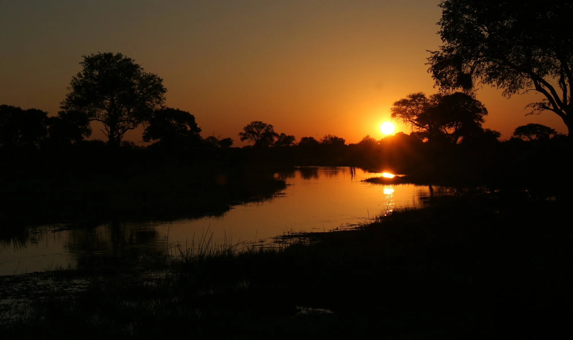 BOTSWANA - KHWAI CAMP OKAVANGO - SUNSET ON THE KHWAI.JPG