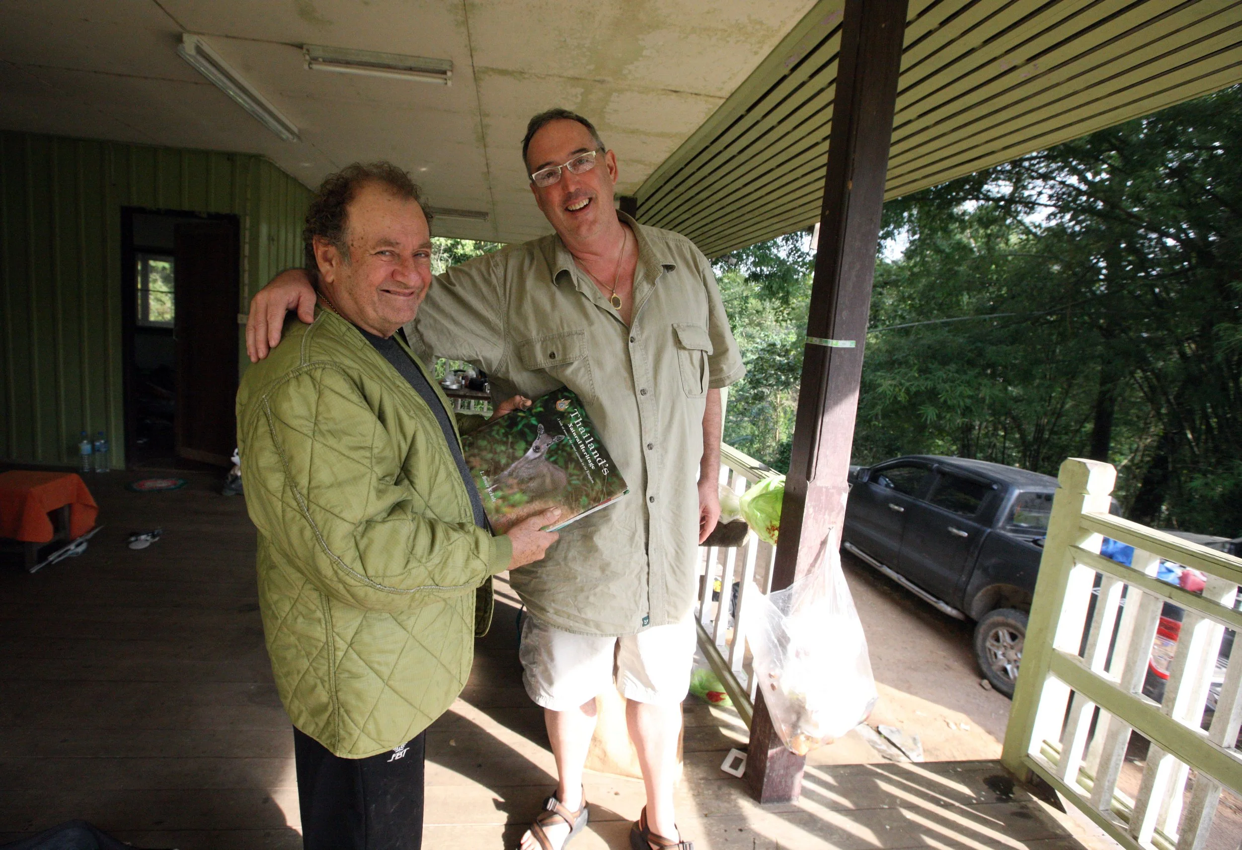 Bruce showing off one of his many books on the natural history of Thailand.