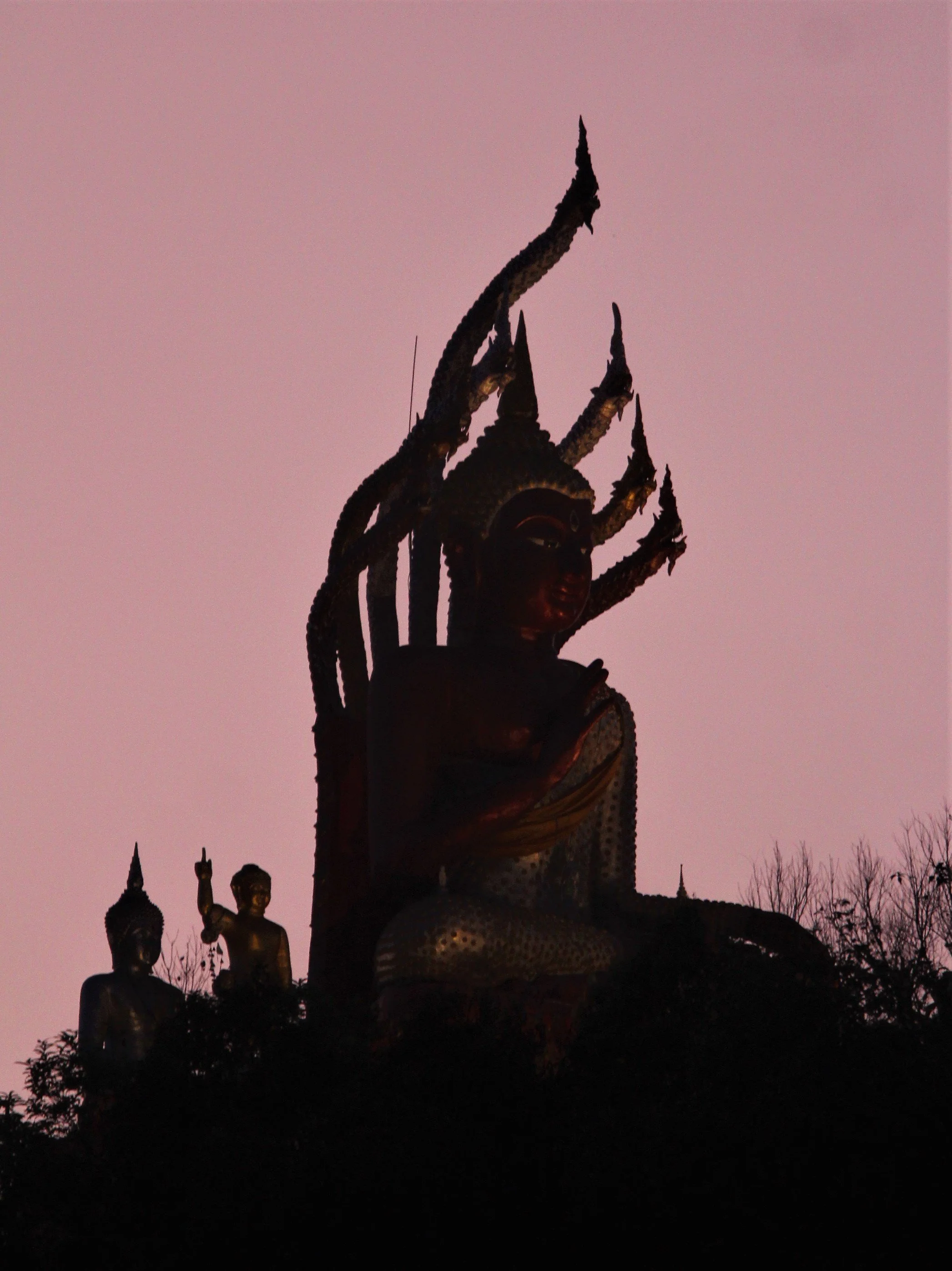 Wat Meuang Pilok in the Thong Pha Phum District of Kanchanaburi Province, Thailand. 
The statue is situated at Wat Meuang Pilok, a community temple in E-Tong village.