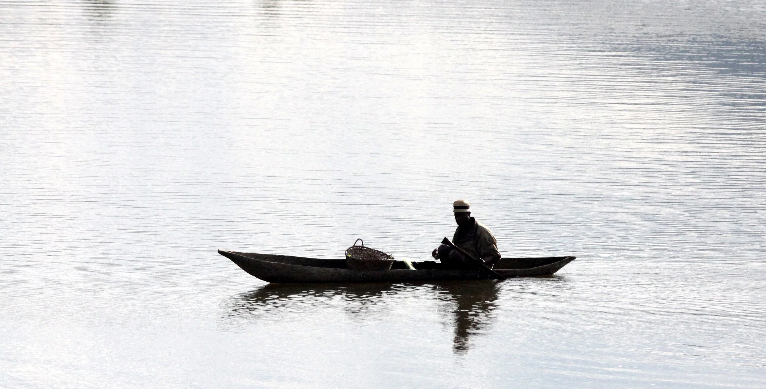 FORT DAUPHIN - FISHERMAN ON RIVER.JPG