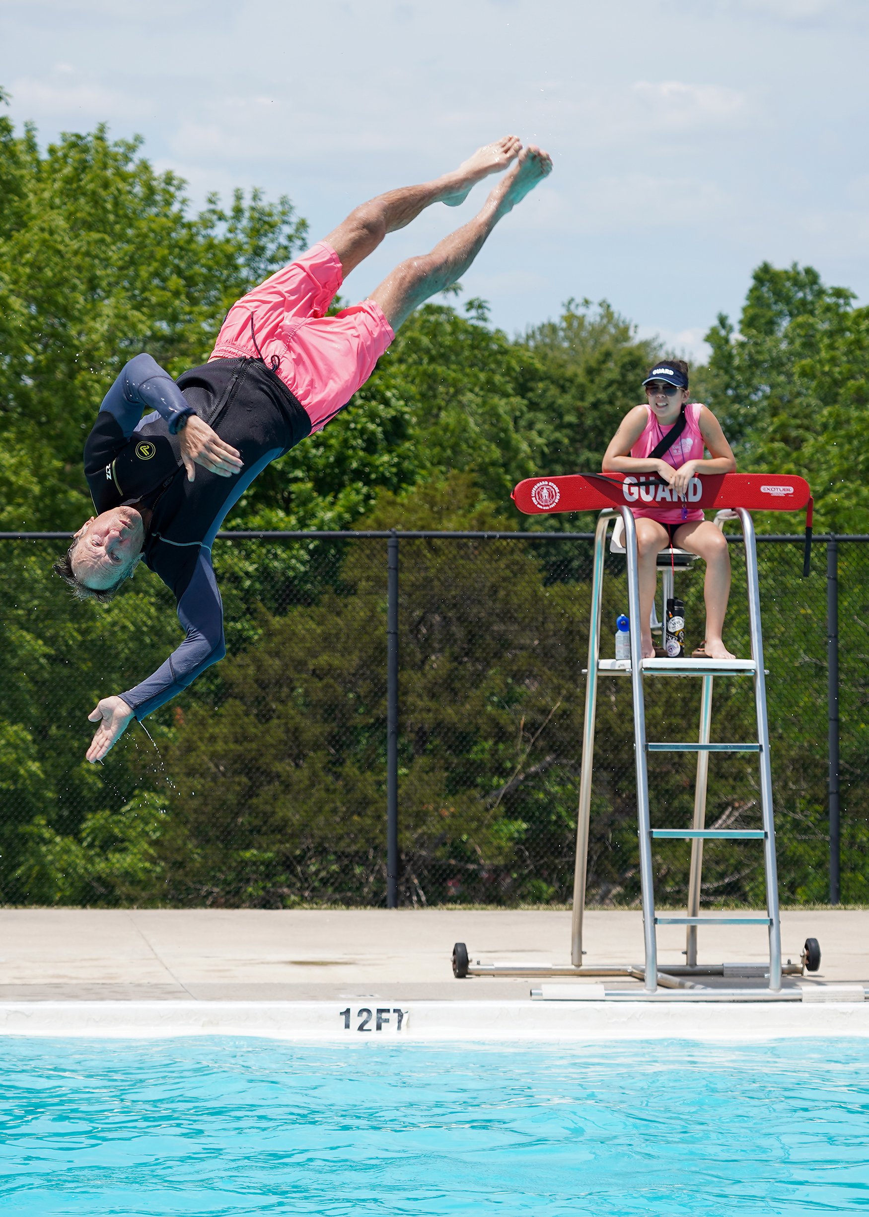 John Drzich flips off the diving board May 29 at Albert-Oakland Family Aquatic Center. Drzich is from Texas but is working in Columbia for the next three months. “I started diving six years ago,” Drzich said. “Having a coach has really helped me prog