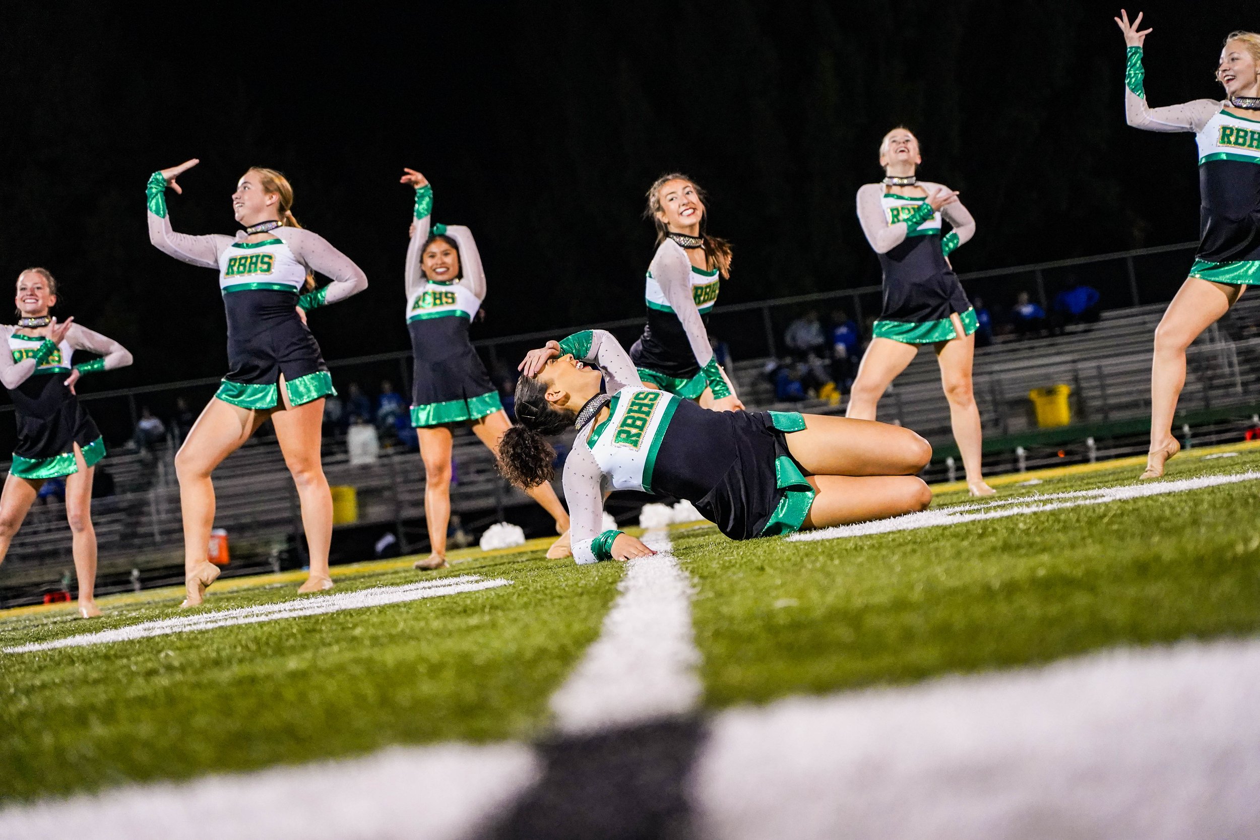 The Rock Bridge dance team performs during halftime at Rock Bridge High School on Sept. 30 in Columbia. The dance choreography was inspired by the Radio City Music Hall Rockettes and featured the iconic line kick sequence.