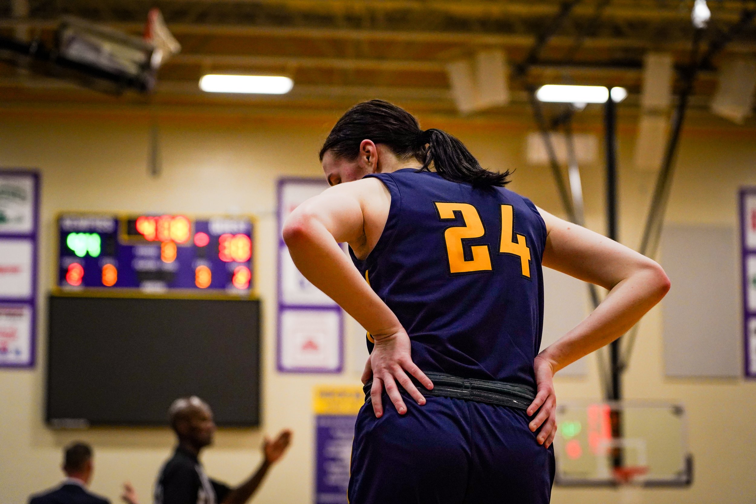Kaelyn Johnson (24) catches her breath after a foul call stopped the game during the second half while her team was losing despite attempts to turn the tide. Johnson, along with fellow seniors Maliyah Miller (2) and Alaina Shettlesworth (20), helped