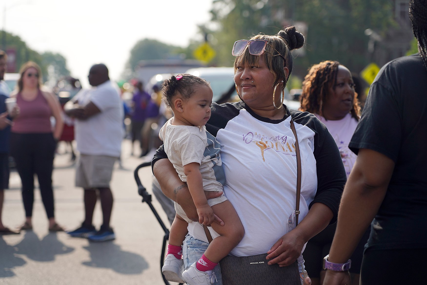 Annie Corpening, right, holds her niece, A’Raea Bradley, 1, before the Juneteenth Parade on June 17 in downtown Columbia. Corpening was part of the Dancing Divas parade float.