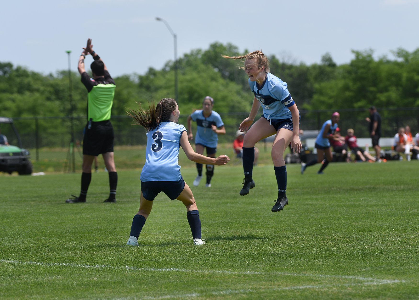 Tolton sophomore Madison Taylor, left, is cheered on by teammate Macie Parmer after scoring the Trailblazers’ fourth and final goal against Laquey on Saturday, May 27 in Columbia.