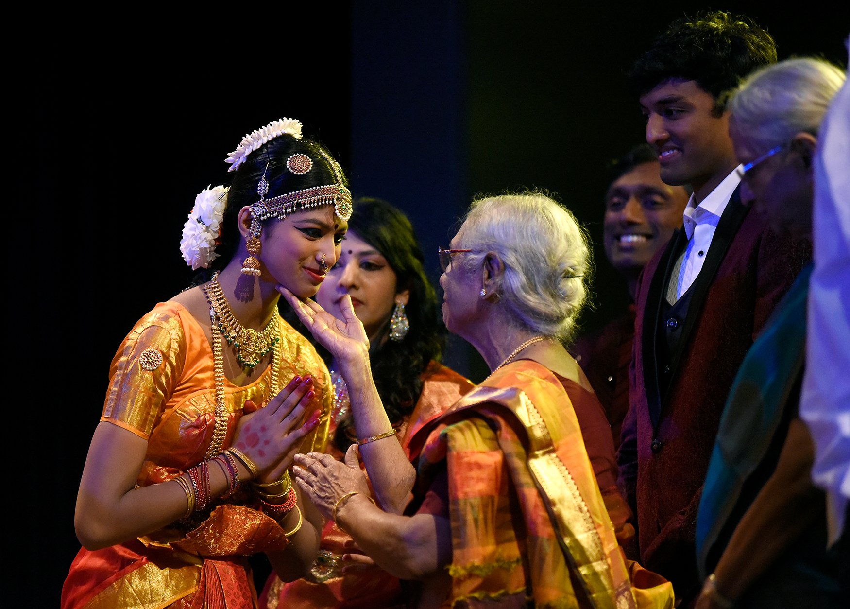 Laya Anand, 13, is blessed by her great-grandmother, Shyamala Sundaram, before her performance June 3 at Battle High School in Columbia. Anand was taught to dance by her mother, Smrita Dorairajan, who runs her own dance studio.