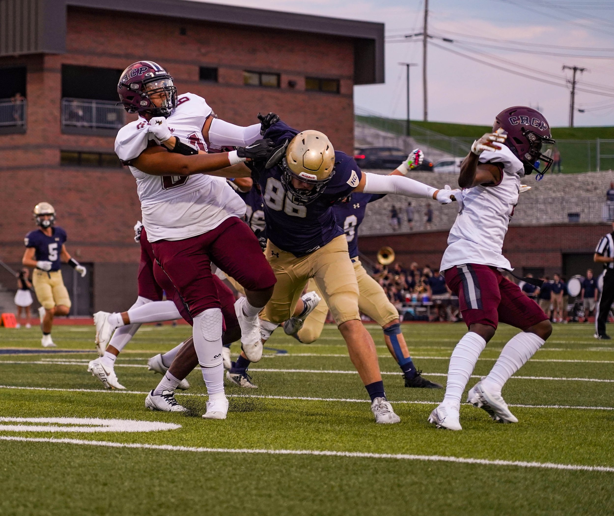 Helias junior Trey Bexton (86) takes on two Cardinal Ritter defenders in search of the ball Sept. 17, 2022 in Jefferson City. Cardinal Ritter beat Helias Catholic 40-14.