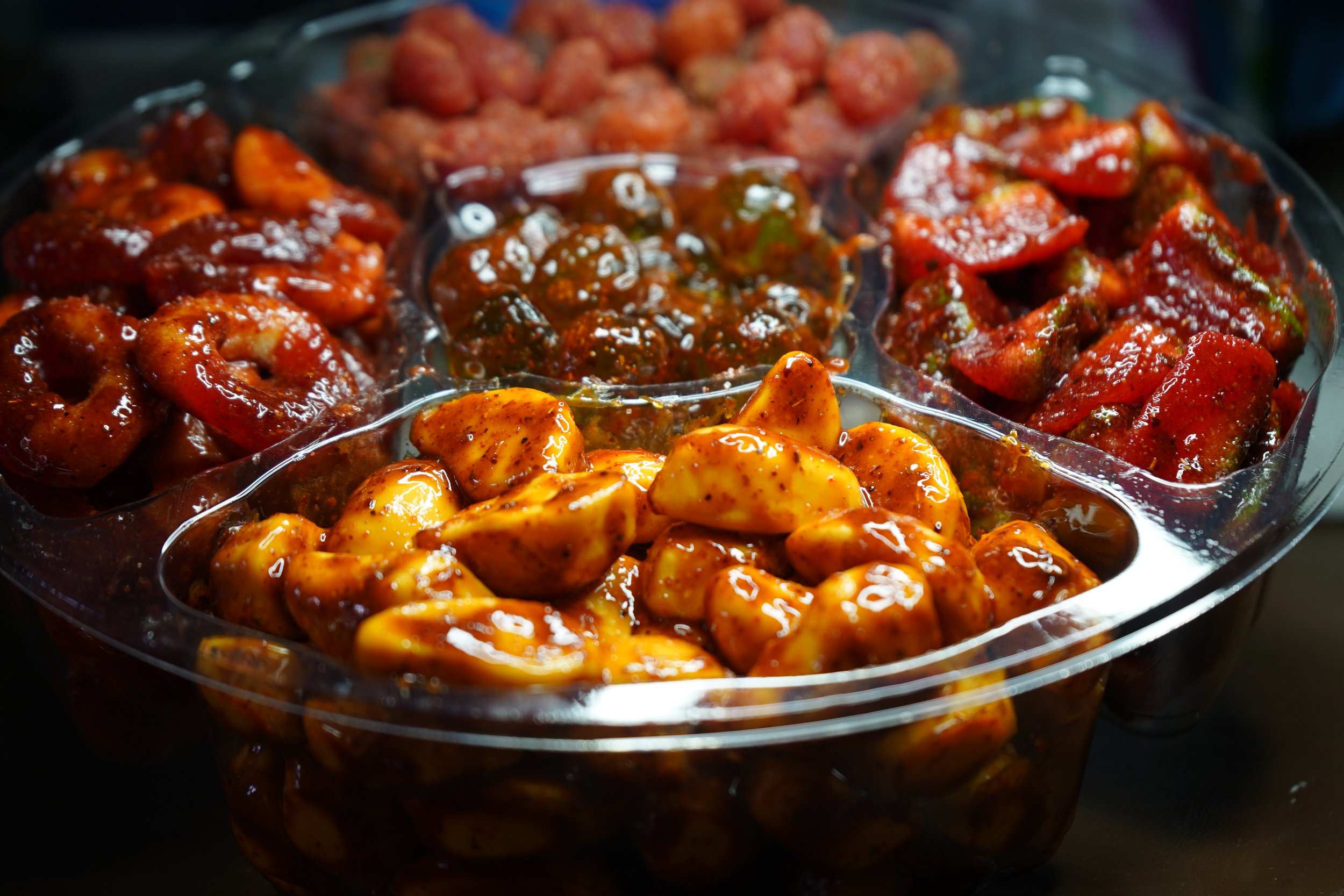 Handcrafted chamoy candies coated in sweet, spicy, and sour chamoy sauce