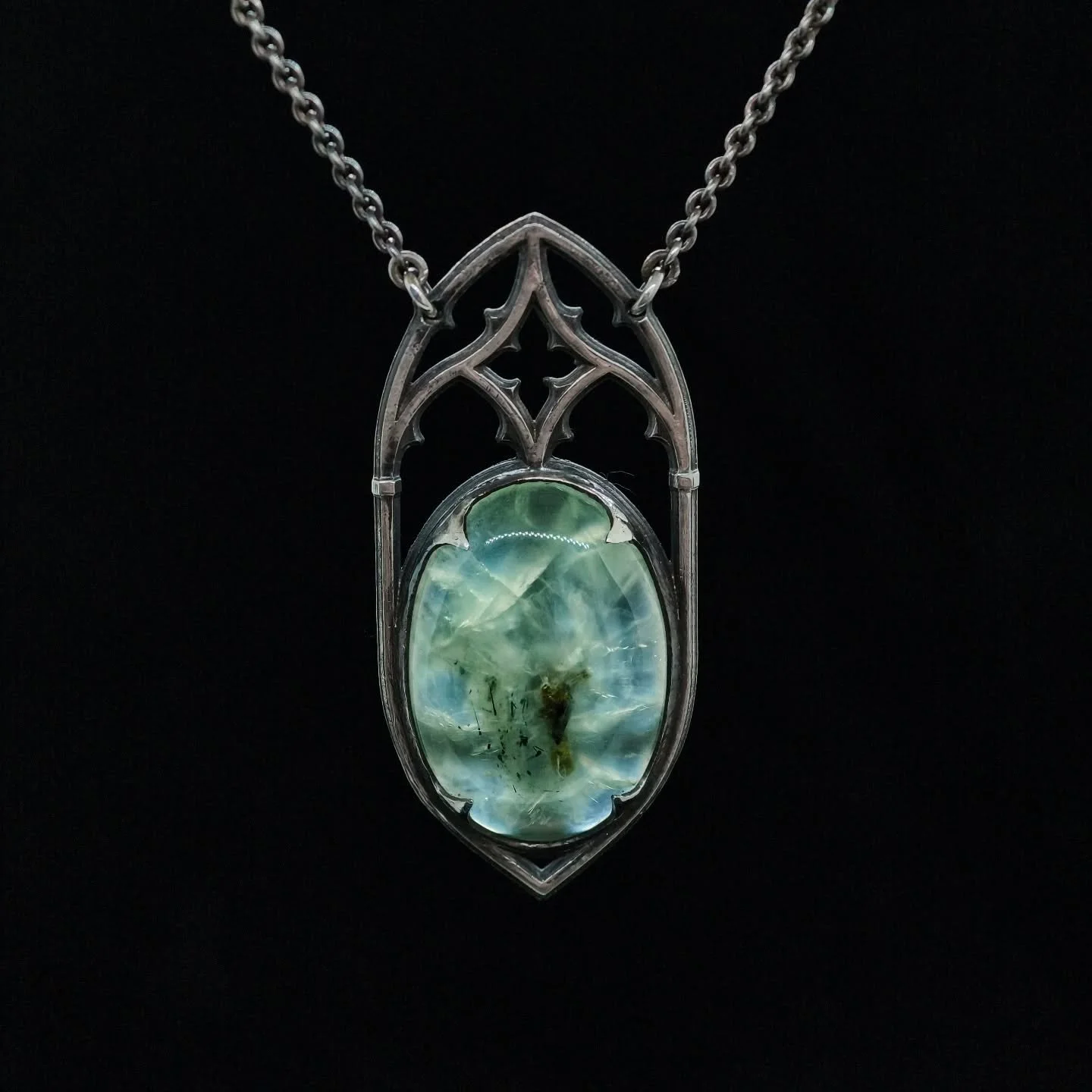 Phrenite set in gothic tracery.
An elegant necklace where the attention to details really got their fair share. 
I'm really glad to have found a home for this phrenite gem.
.
.
#gothicjewelry #necklace #phrenite #smallartisans #handmade