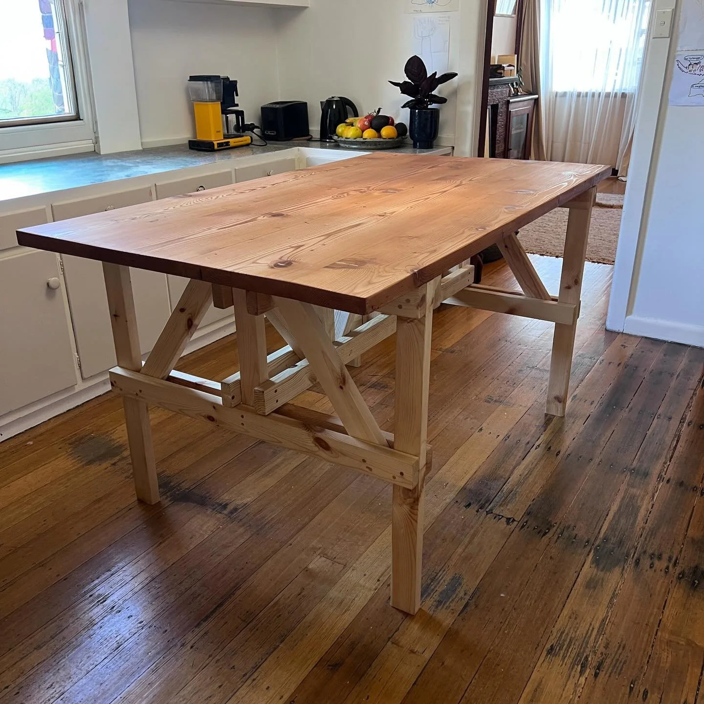 Enzo Mari 

Finally made one for myself.

This table is based on a design by Enzo Mari, an Italian designer who, in 1974, released a series of open-source furniture plans called Autoprogettazione. The idea was simple: anyone could build good design u