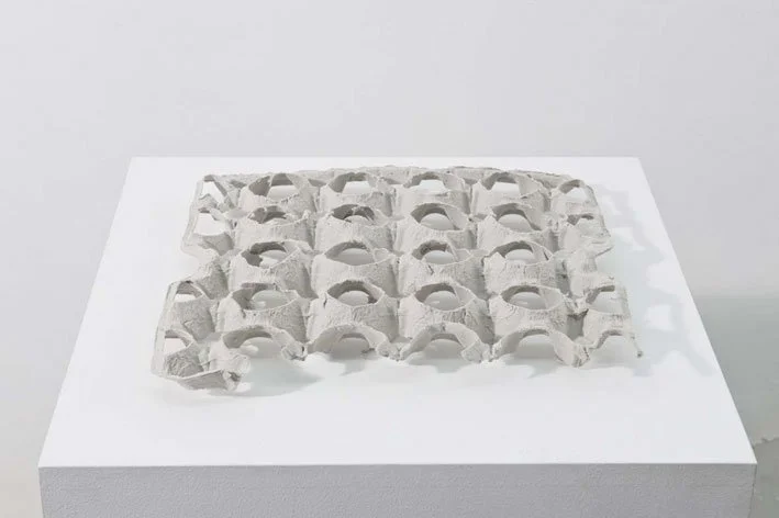  Bunga’s object on view at the exhibition. Carlos Bunga.  Artifact #1 , 2010. Cardboard. 2x 29 x 29 cm.  