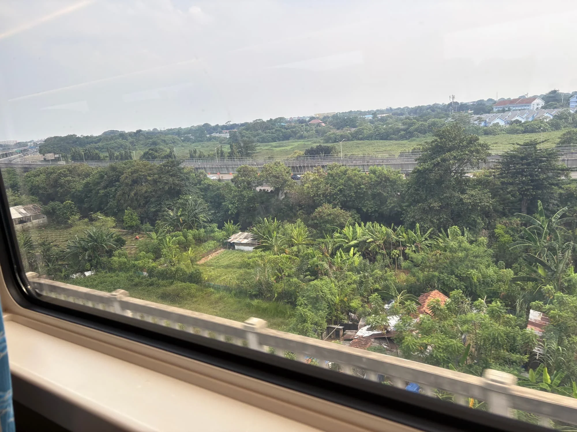 view from train in Indonesia showing countryside travel with reliable eSIM data coverage across regions
