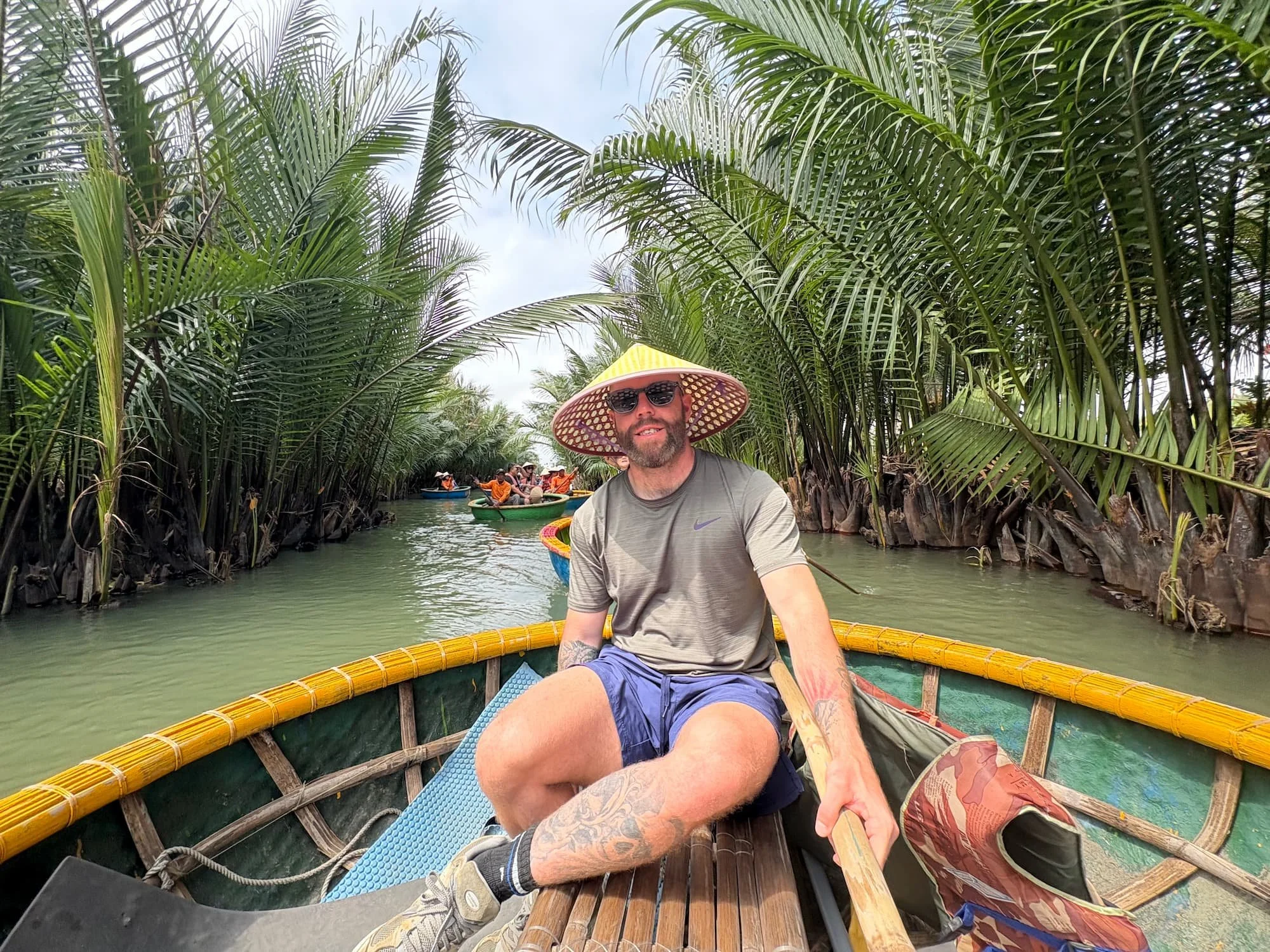 Tom HEnty Enjoying the coconut basket boat tour in Vietnam.