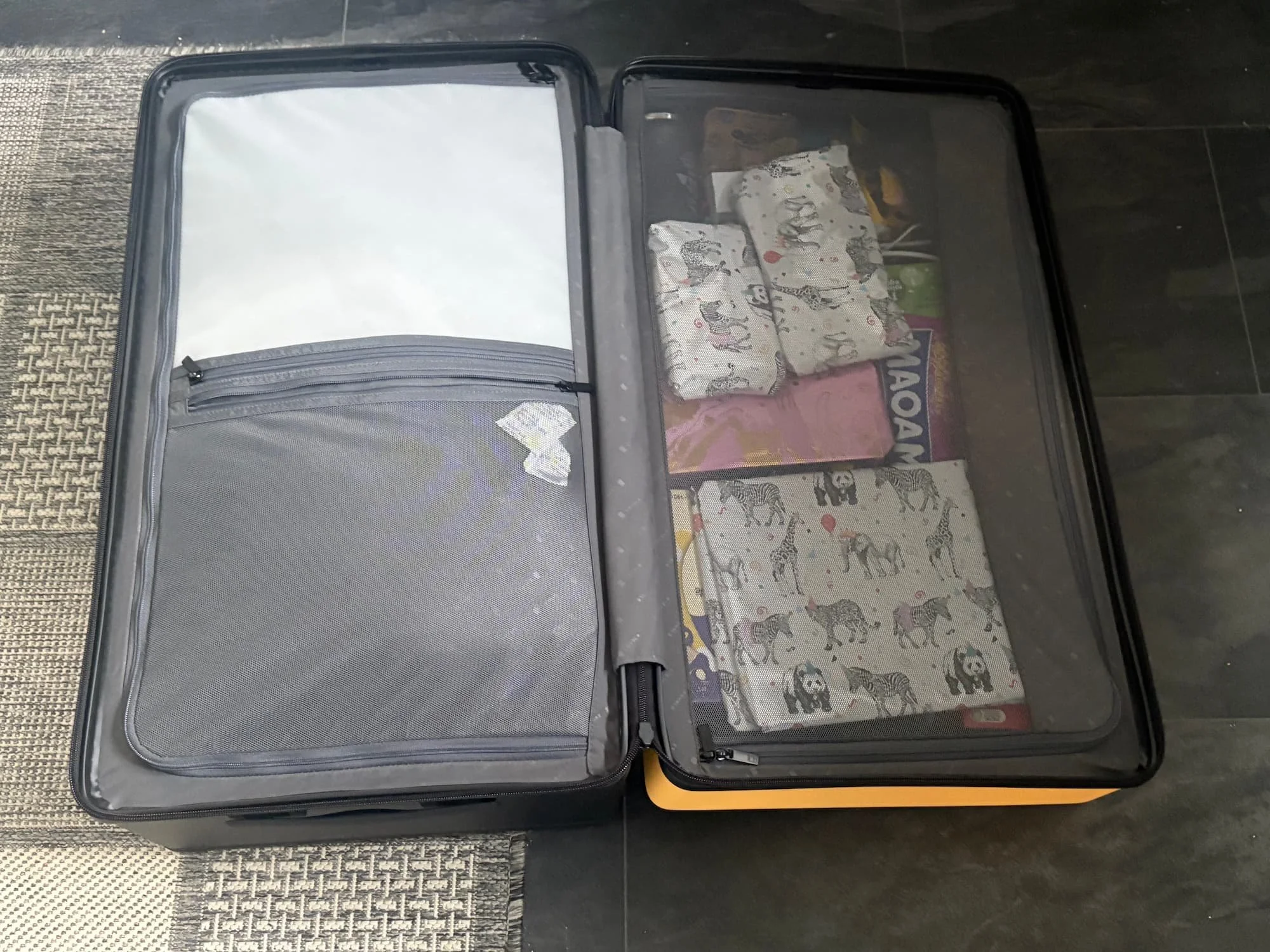 Level 8 Voyageur suitcase packed with presents and clothes