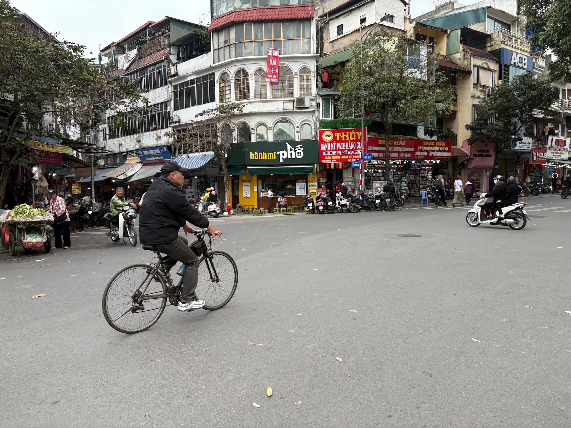 A local cyclign through Old Quarter in Hanoi in Vietnam