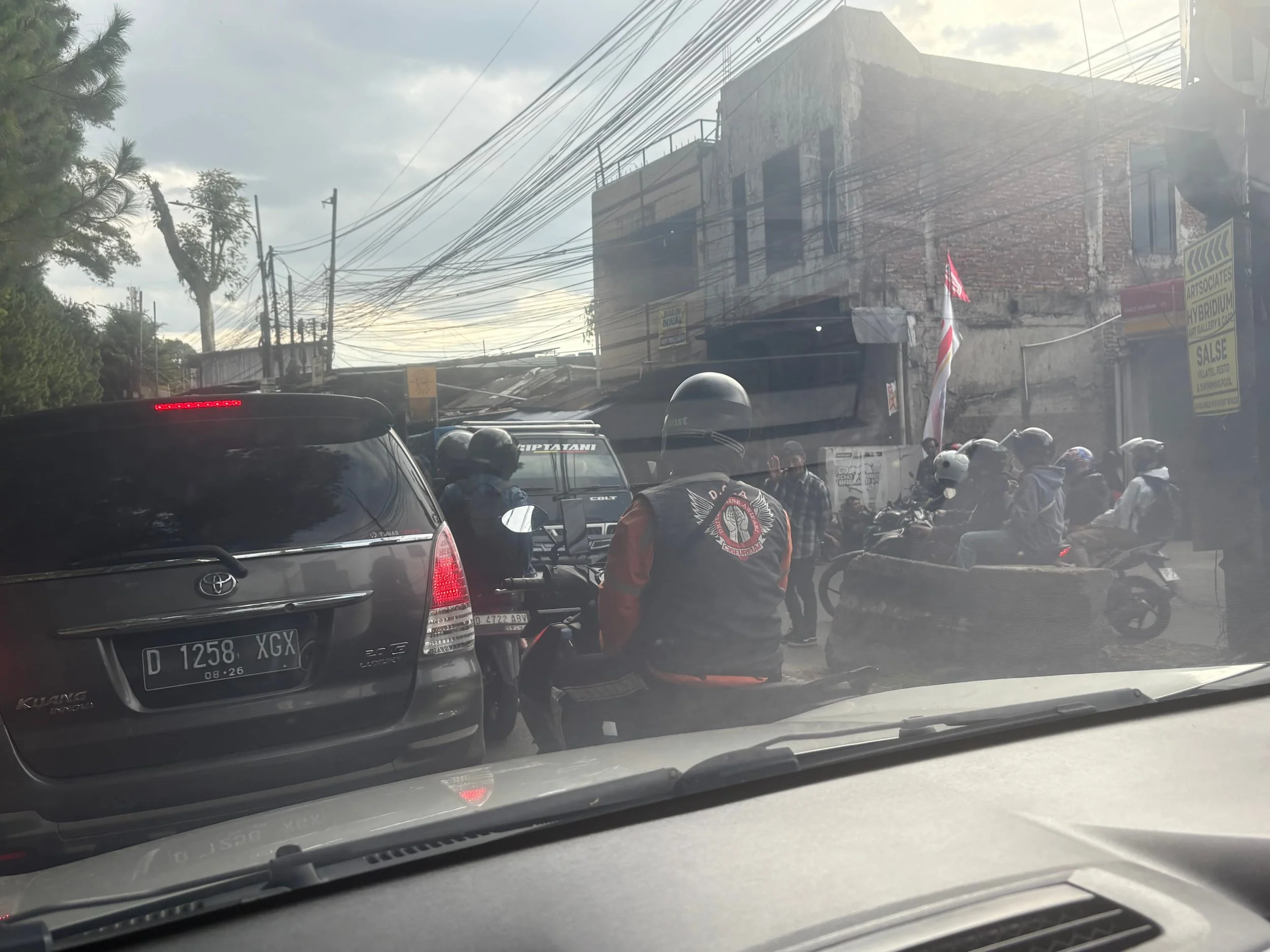 Heavy traffic in Jakarta with motorbikes and cars showing why using Grab and eSIM data is essential