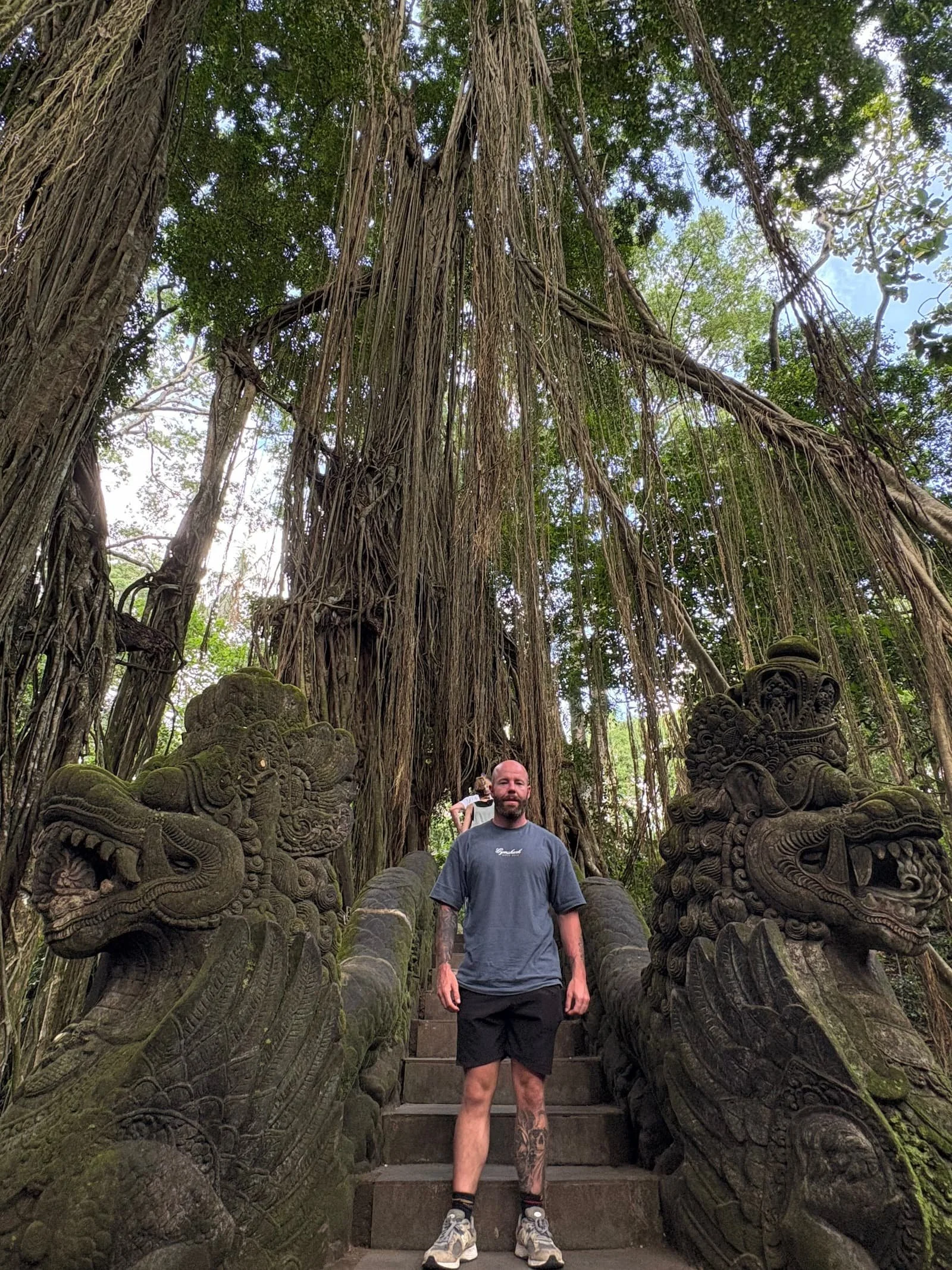Tom Henty stood in front of a famous tree at at the Sacred Forest in Ubud in Bali