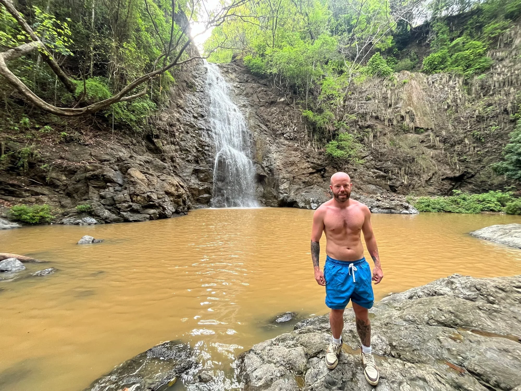 Tom Henty stood at Montezuma Waterfall in Costa Rica