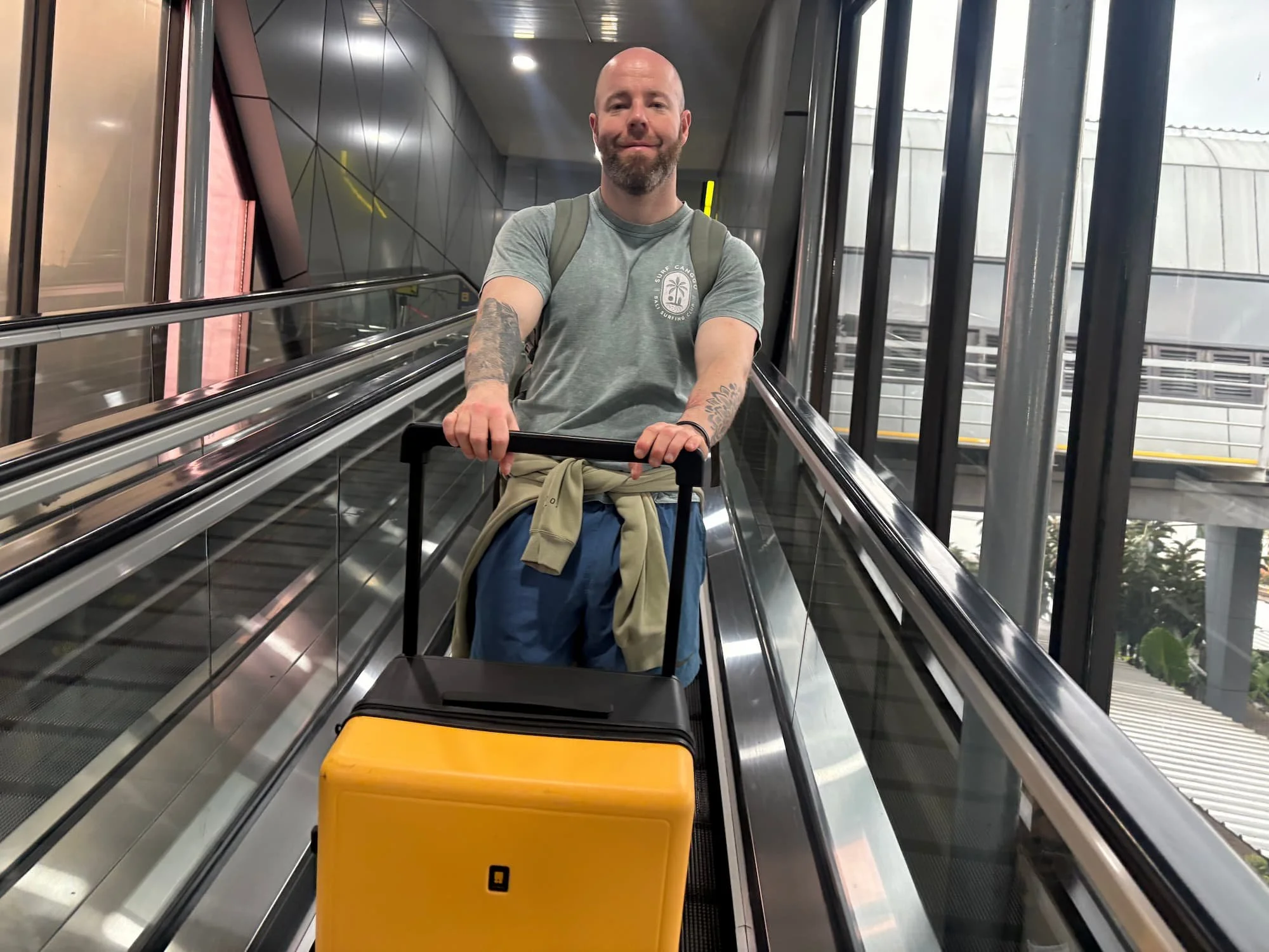 Tom Henty pushing Level8 Voyageur Suitcase through Bandung Train Station