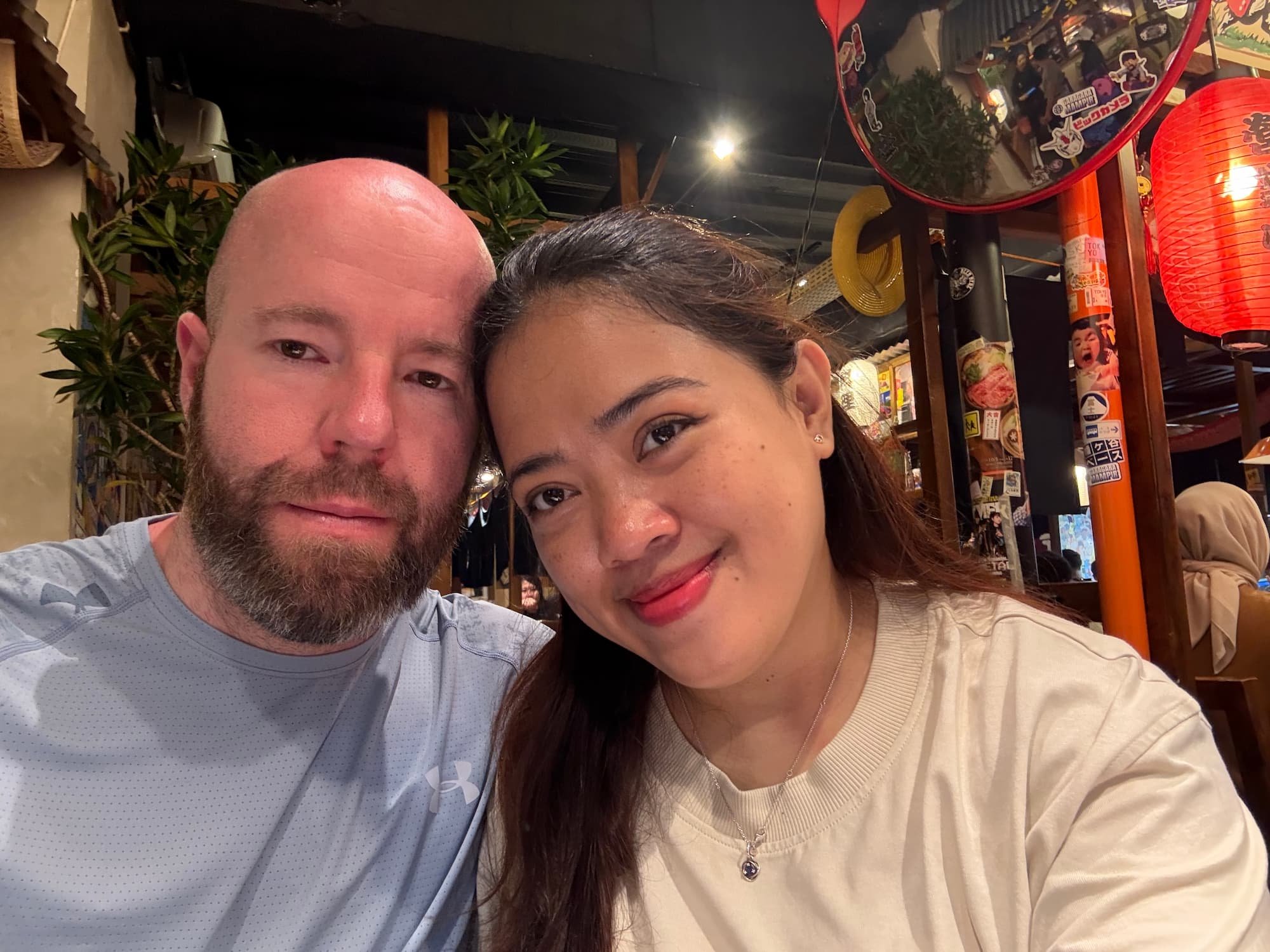 Tom Henty and girlfriend in a local restaurant in Bandung