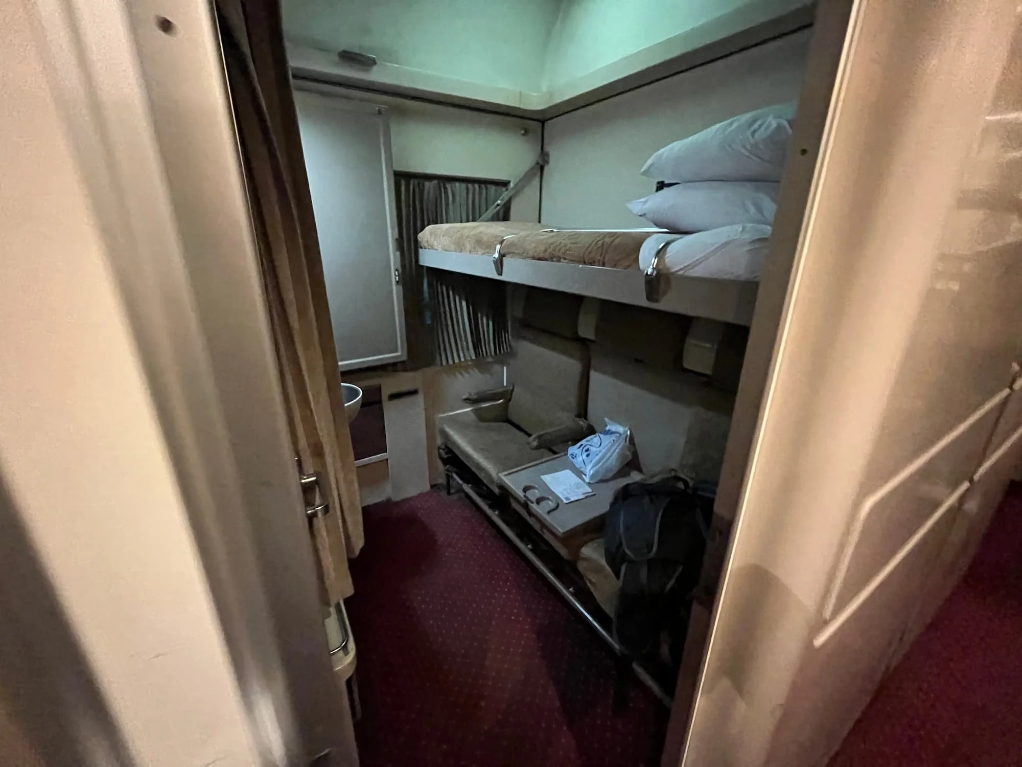 Overnight sleeper train cabin in Egypt showing travel conditions where mobile data still works