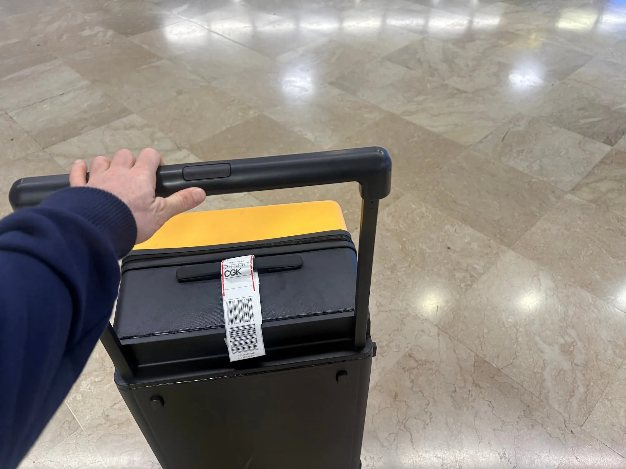 Tom Henty pushign wide handle on Level 8 Voyaguer suitcase