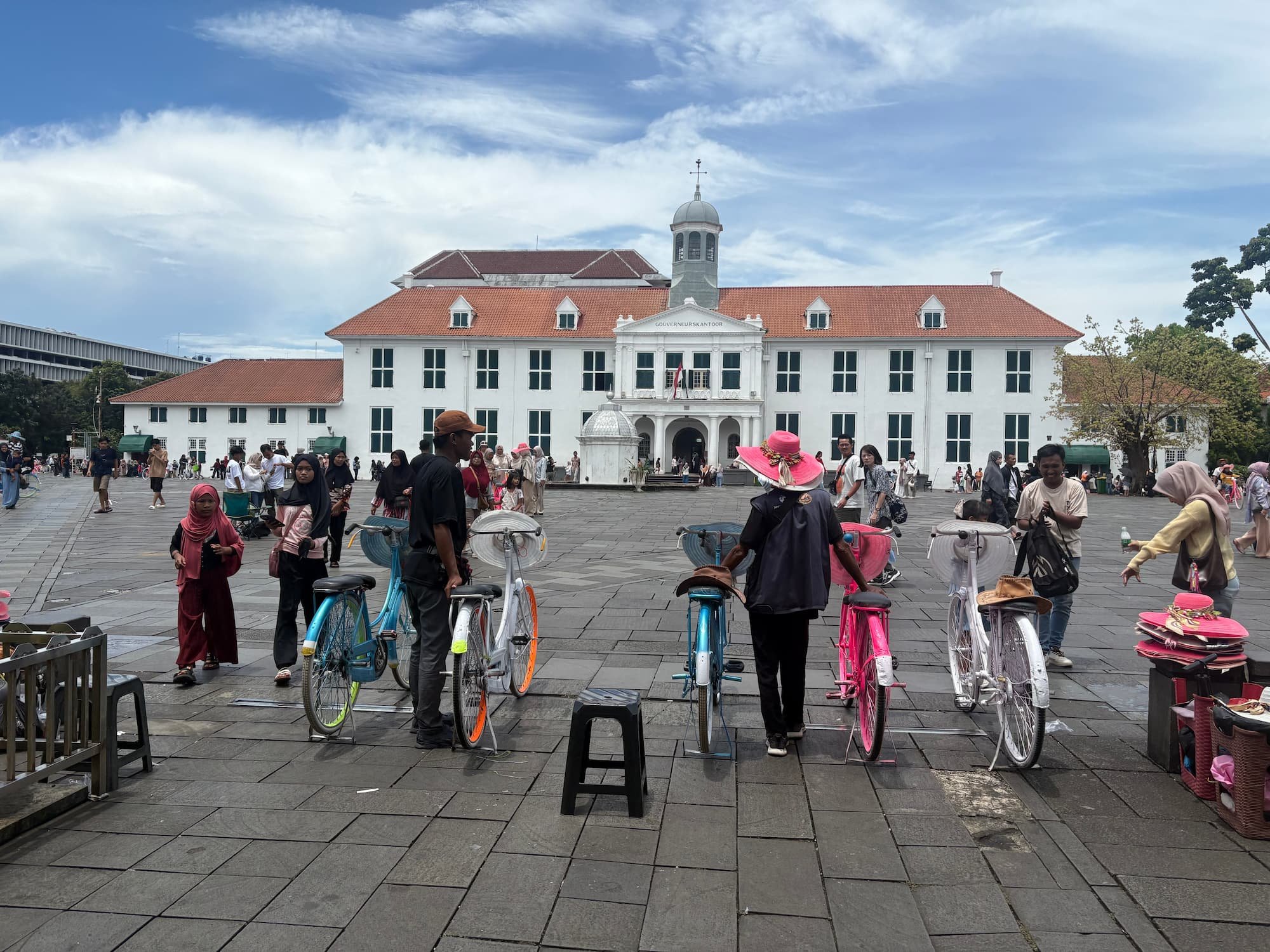 Kota Tua Jakarta old town square with bikes and tourists showing walking route navigation using eSIM data