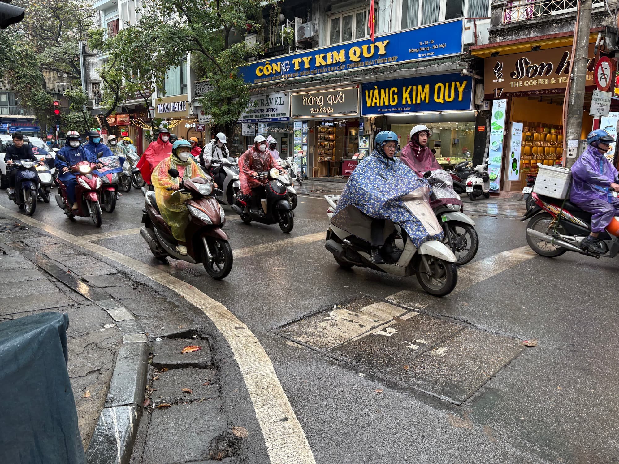 Scooters riding though streets of the old Quarter in Hanoi in Vietnam