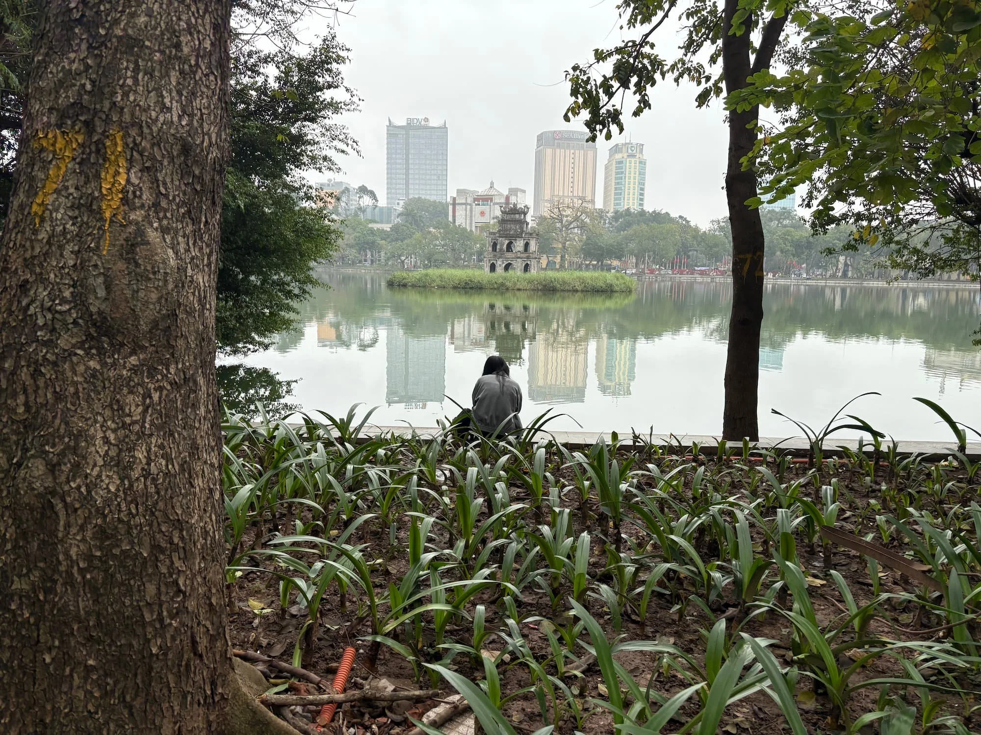 A local sat by the lake in Hanoi in Vietnam