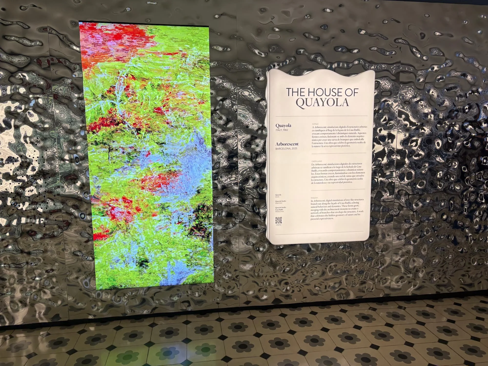 Immersive digital art installation inside Casa Batlló featuring reflective metallic walls and colourful visual displays.