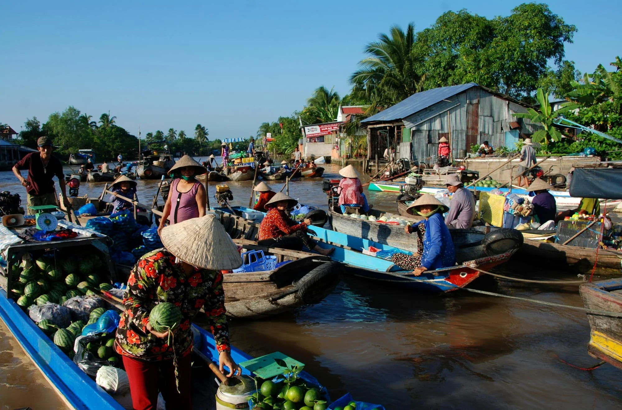 Locals on boats on Mekong Delta in Vietnam