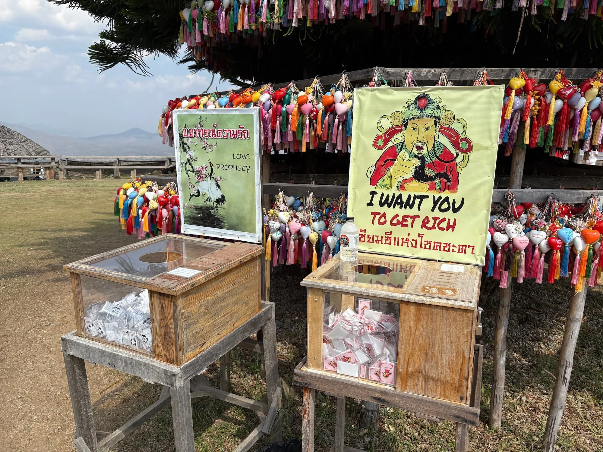 Cantones themed good luck money donation box at Ban Santichon in Pai in Thailand