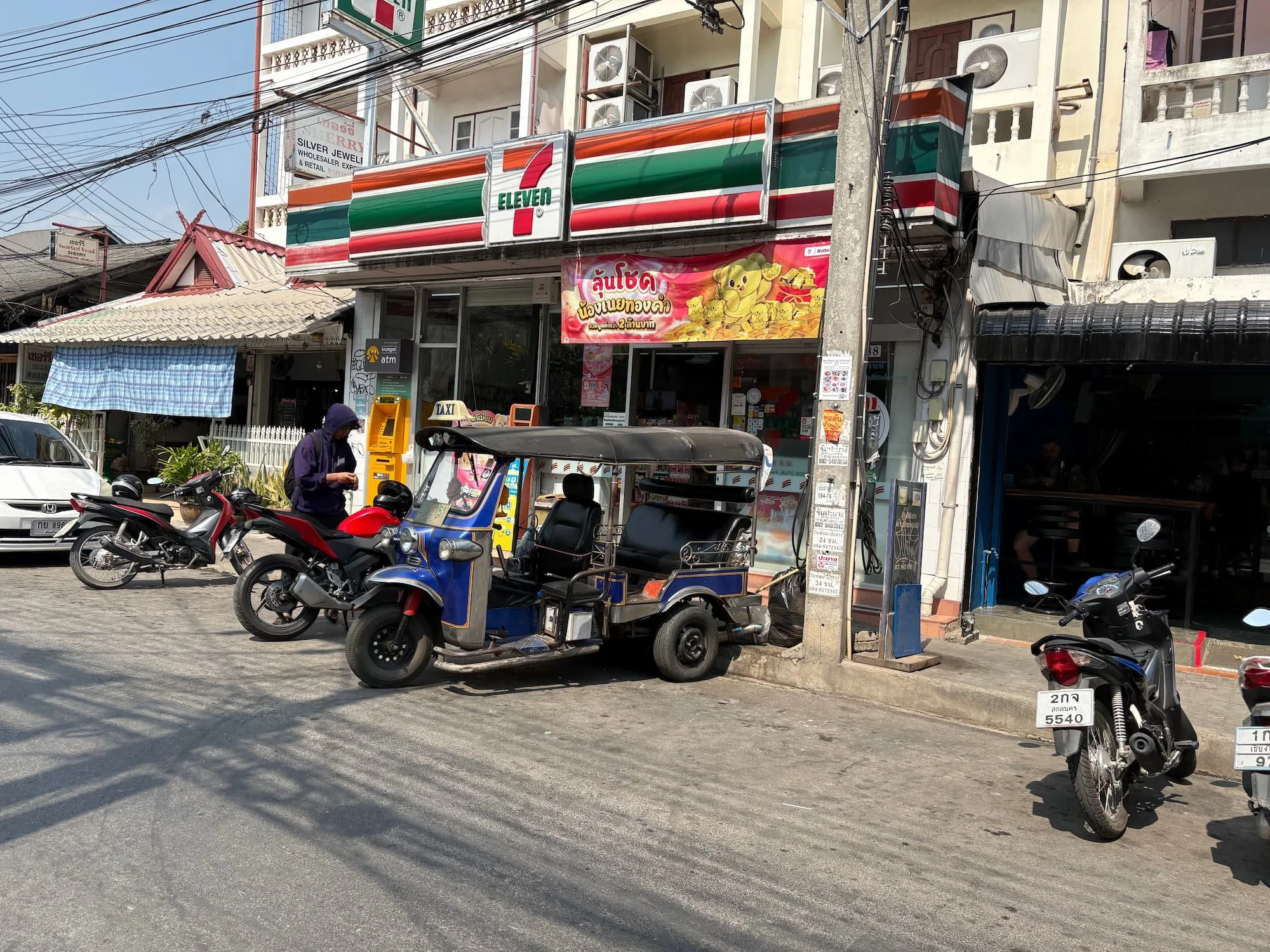 Tuk Tuk parked up outside of 7/11 in Chiang Mai in Thailand