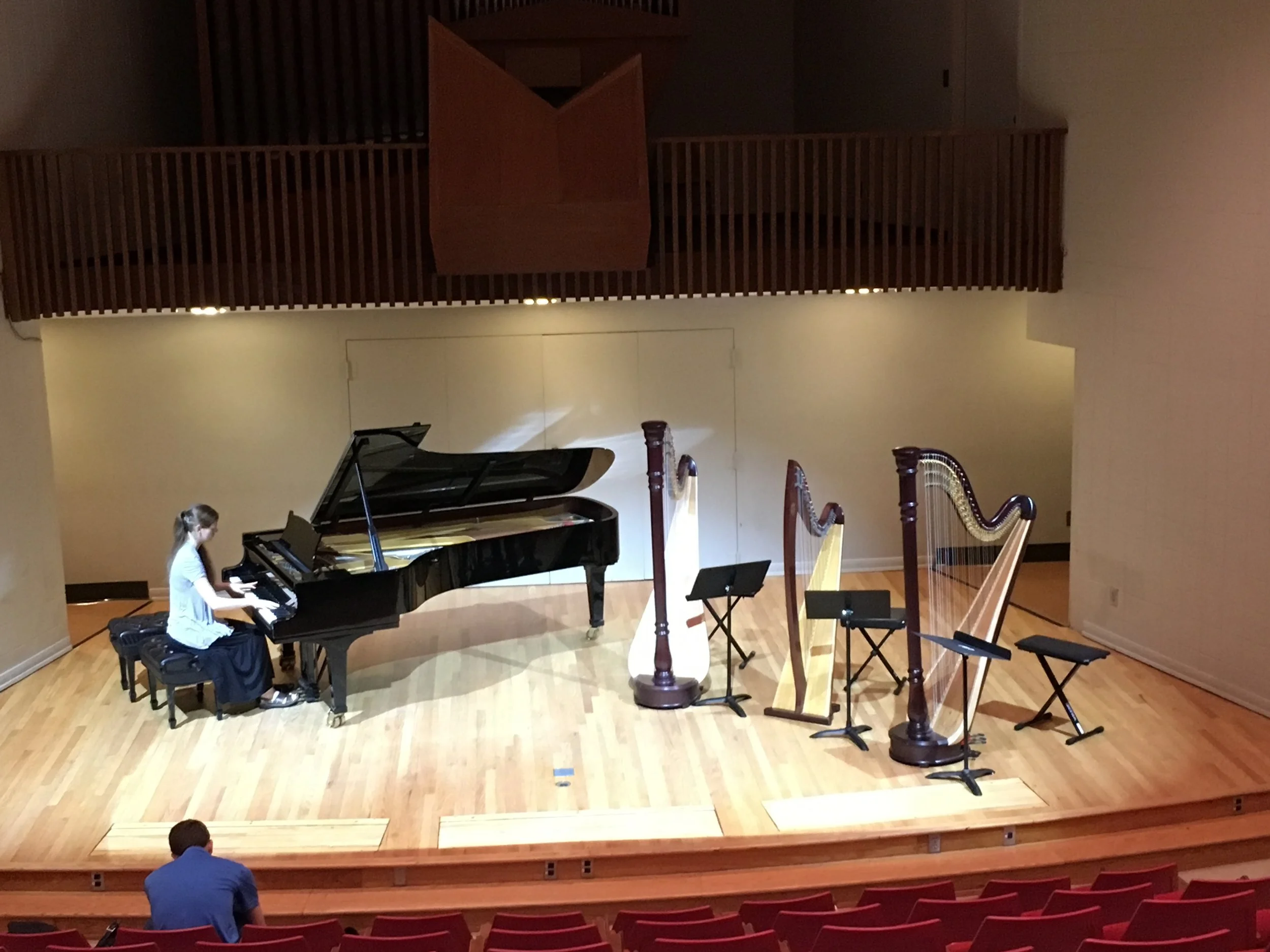 Setting up for a recital in LeBaron Hall in Davis Hall at the University of Montevallo