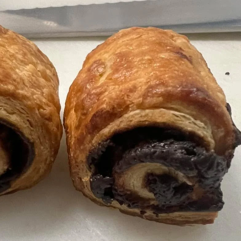 Holidays mean great foods, and one of my all time favorites is our Chocolate Ruggies. We have sold these in our shops since 1989. Beautiful butter and cream cheese dough with our Chocolate Ganache rolled in. Personal favorite and here while supplies 