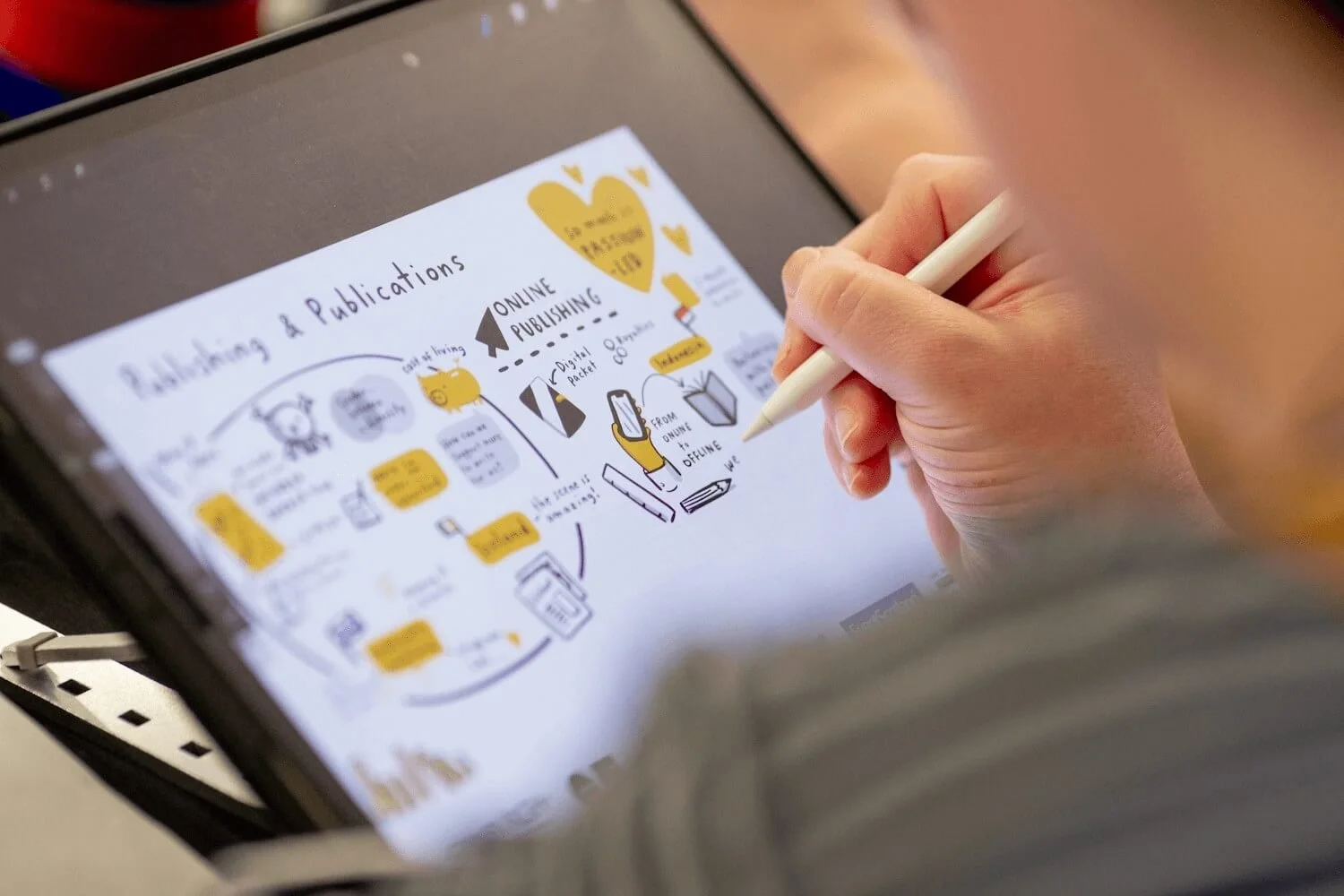 Katie Chappell creating a live illustration digitally on an iPad.