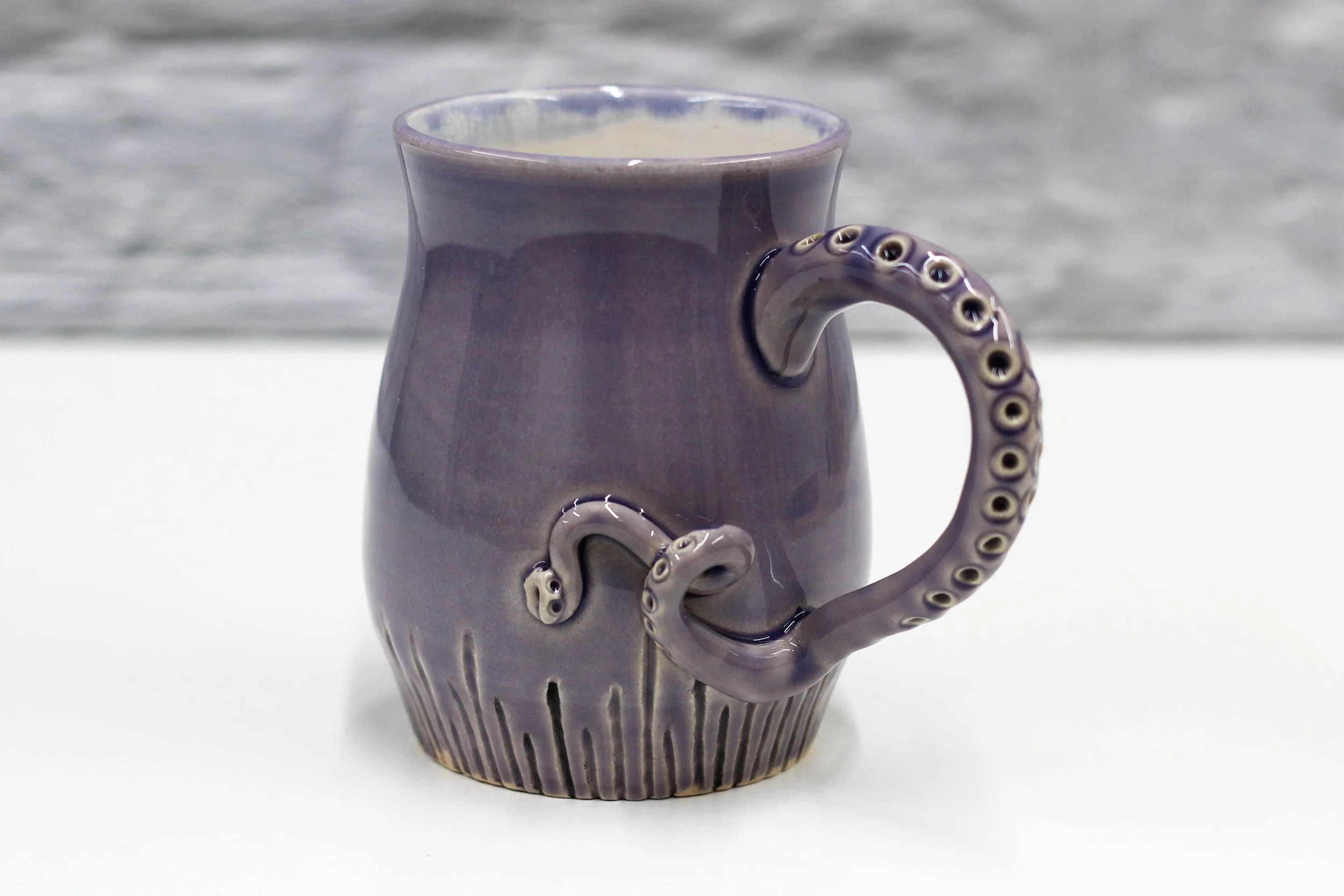 Handmade ceramic purple octopus tentacle mug with shells