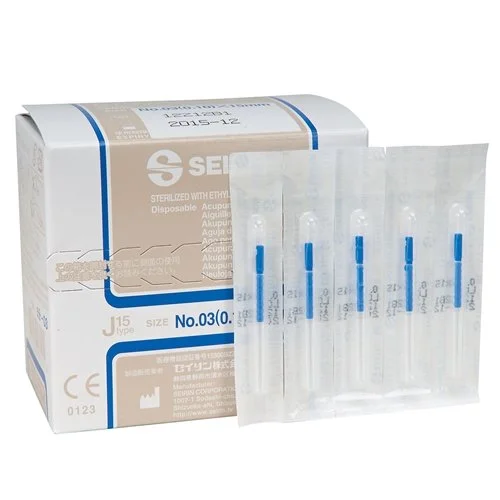 A box of disposable acupuncture needles with five individual needles in clear plastic packaging